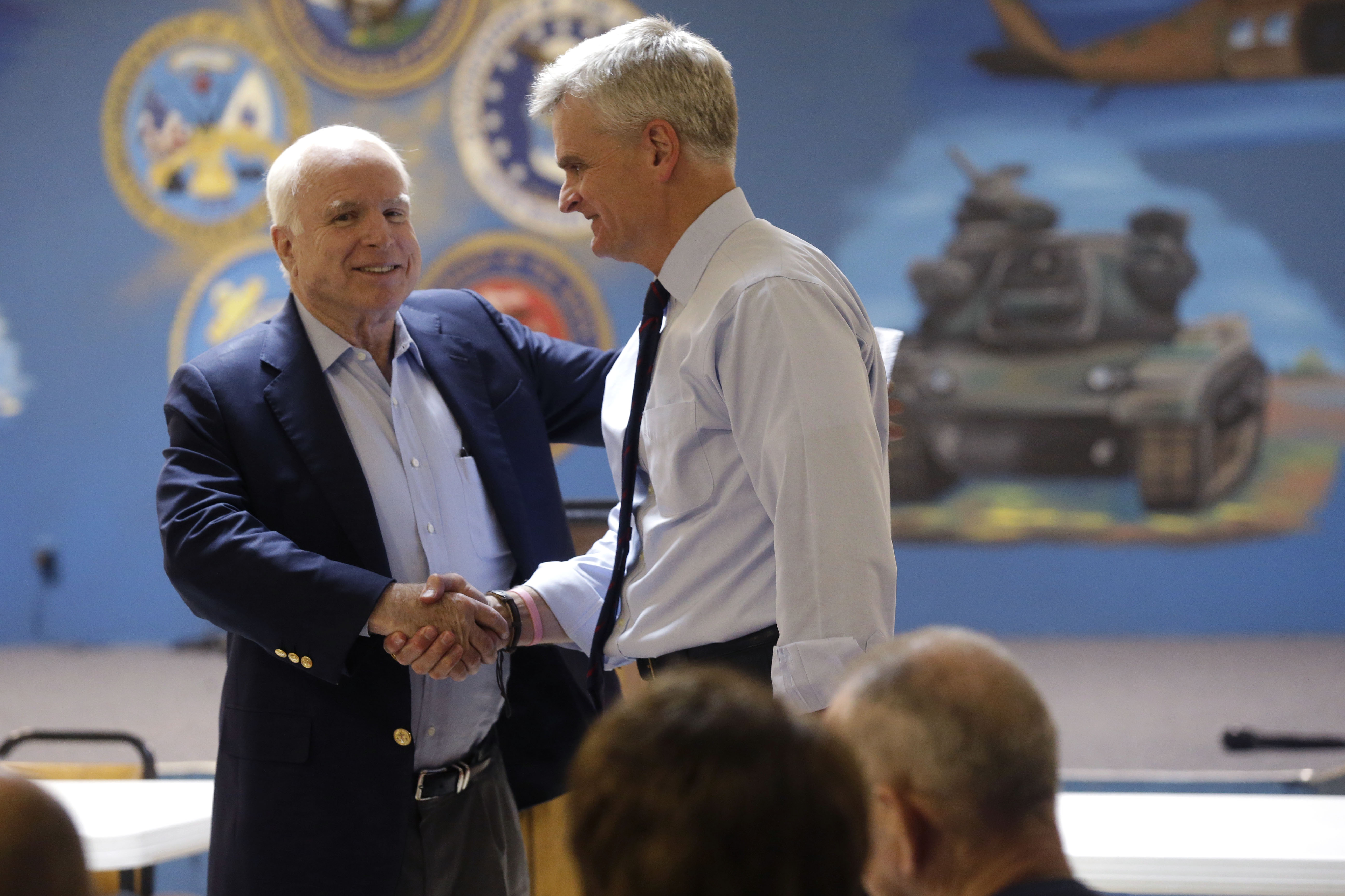 Sen. John McCain, R-Ariz., introduces Senate candidate, Rep. Bill Cassidy, R-La., at a campaign stop at VFW Post 5951 in Bossier City, La., Monday, Oct. 13, 2014. (AP Photo/Gerald Herbert)