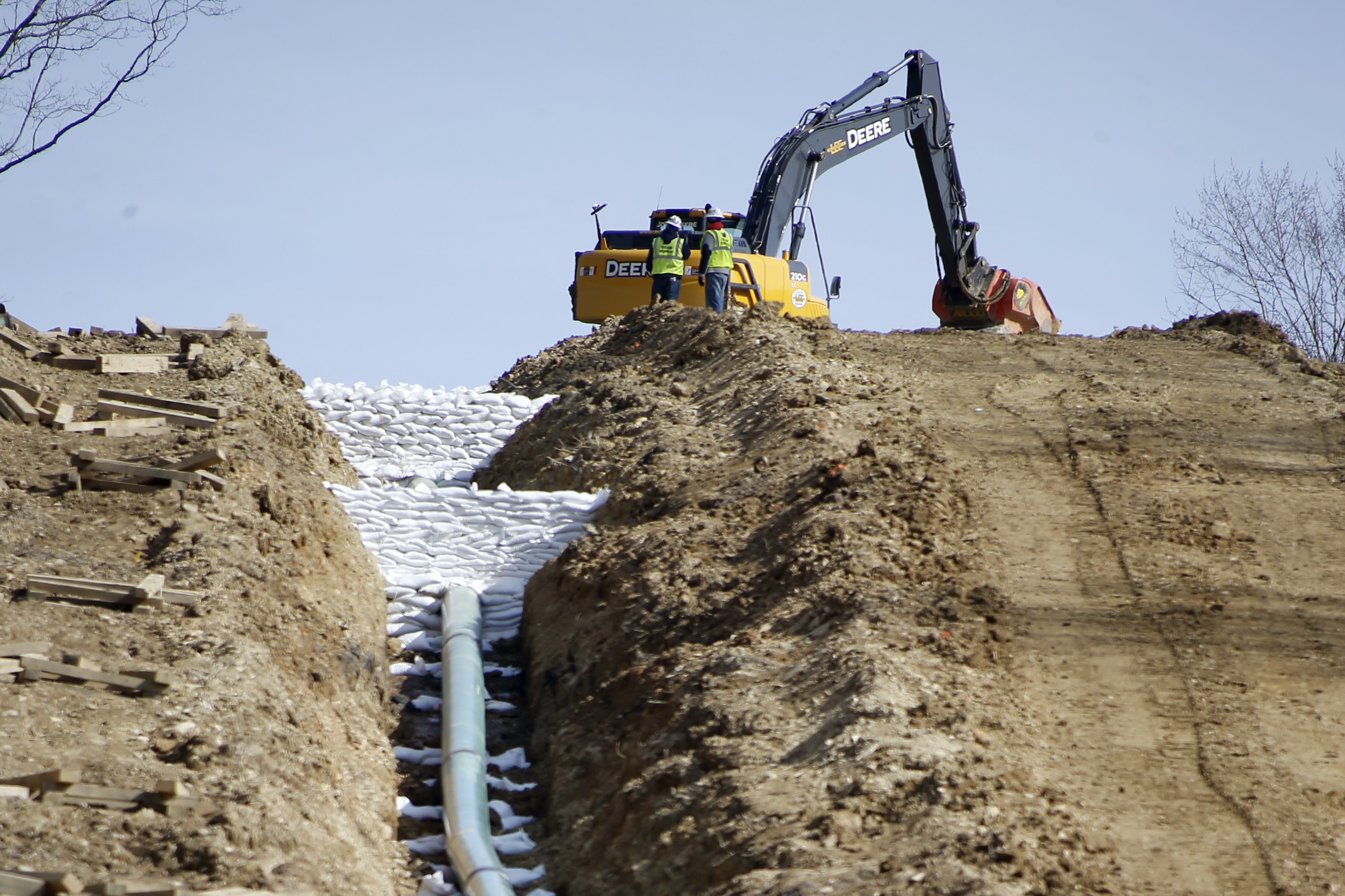 Workers continue the construction at a gas pipeline site in Harmony, Pa. CREDIT: AP Photo/Keith Srakocic