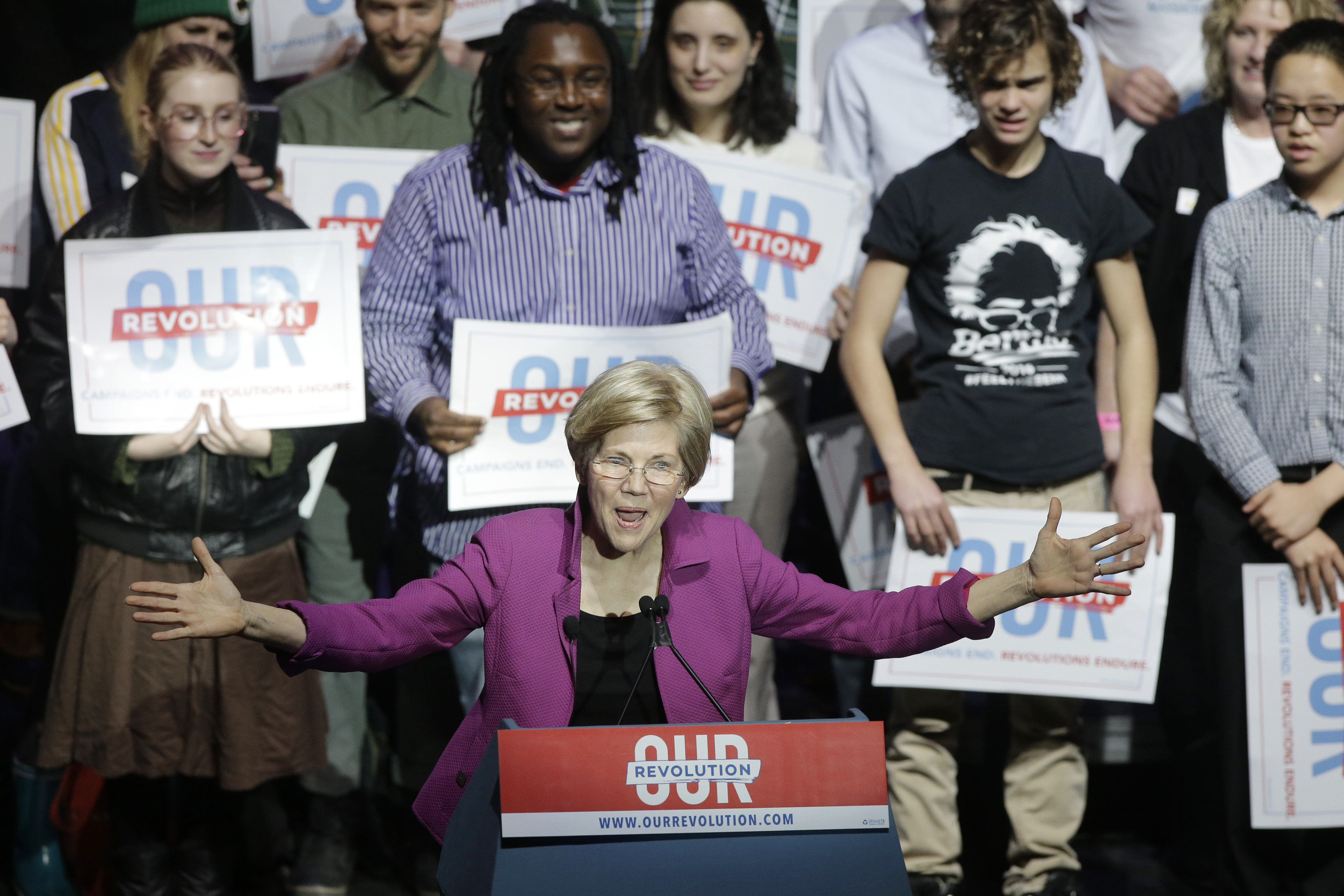 Sen. Elizabeth Warren, D-Mass., addresses an audience during a rally Friday, March 31, 2017, in Boston. Sen. Bernie Sanders, I-Vt., and Warren made a joint appearance at the evening rally in Boston as liberals continue to mobilize against the agenda of Republican President Donald Trump. CREDIT: AP Photo/Steven Senne