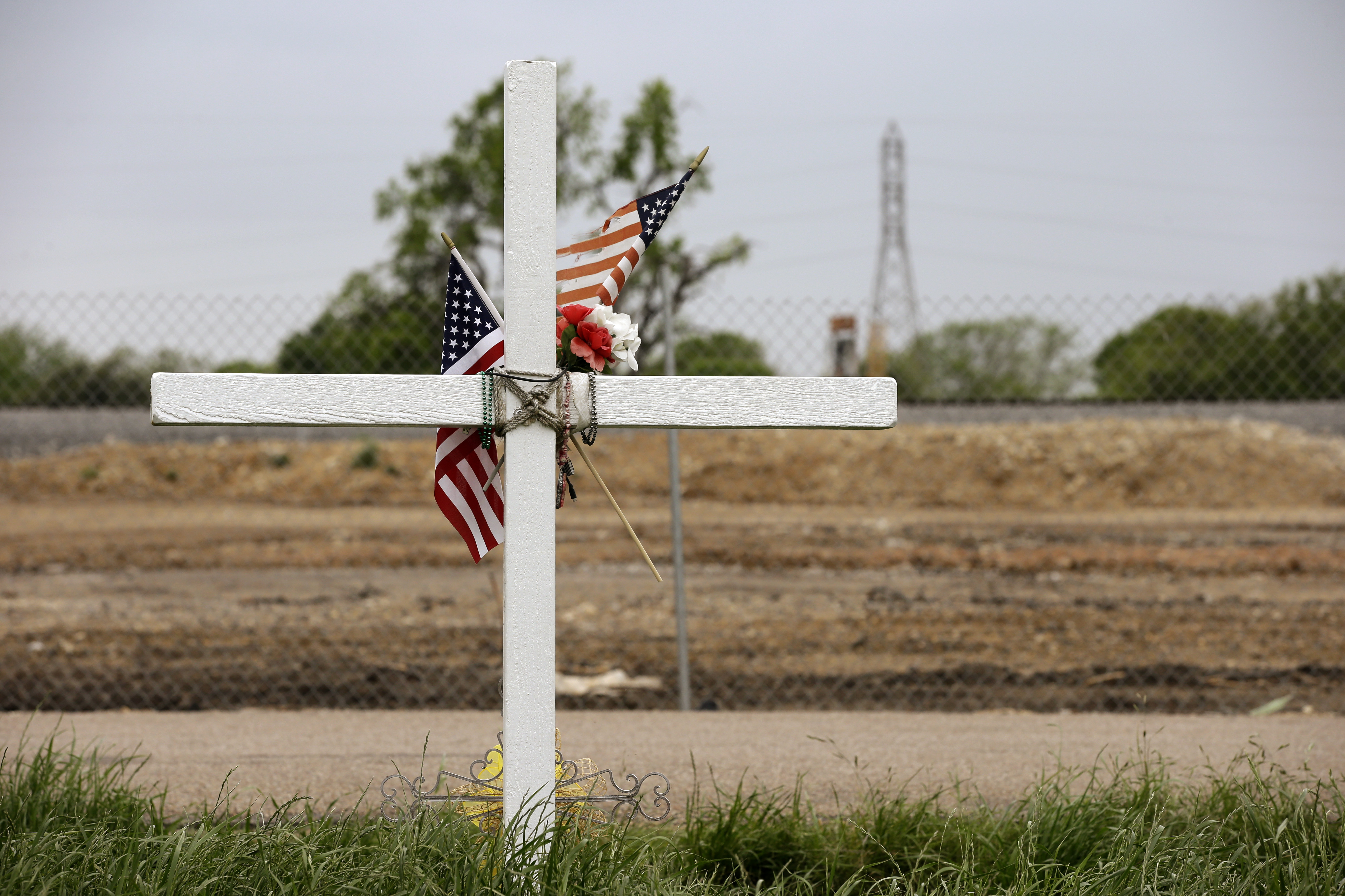 A cross memorializes a victim of a 2013 fertilizer plant explosion in West, Texas. The explosion killed 15 people, including 12 volunteer firefighters. CREDIT: AP Photo/Tony Gutierrez