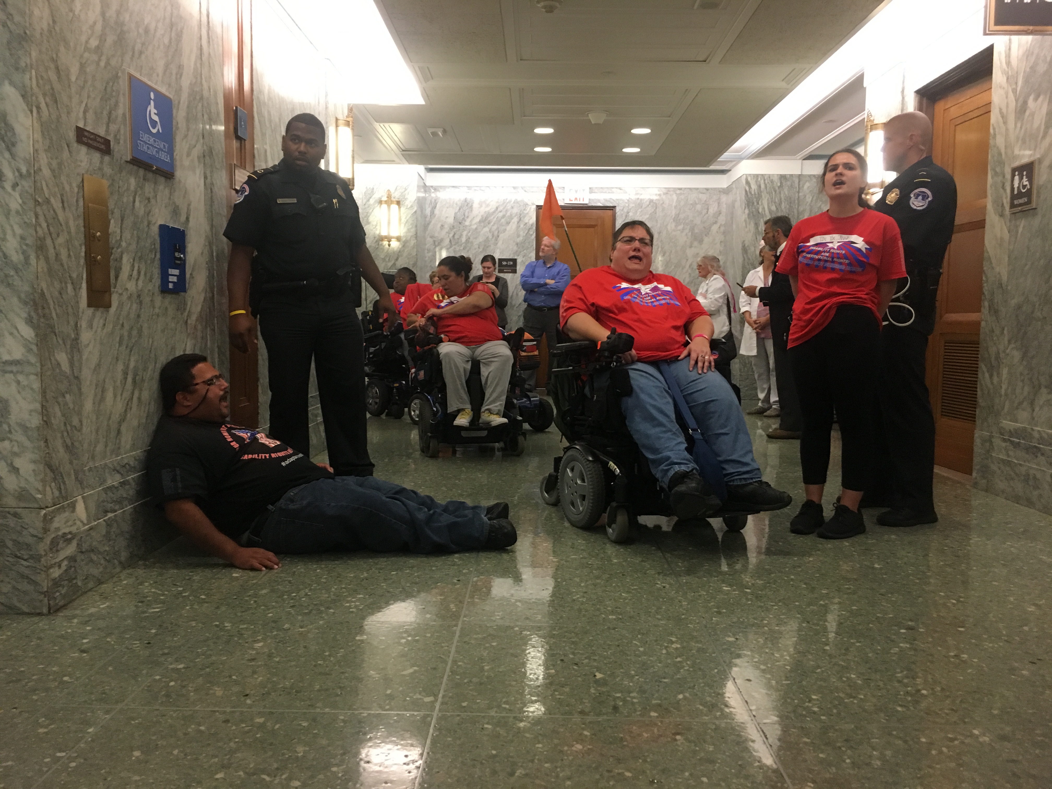 Activists in wheel chairs are arrested at the U.S. Capitol Monday. CREDIT: Kira Lerner