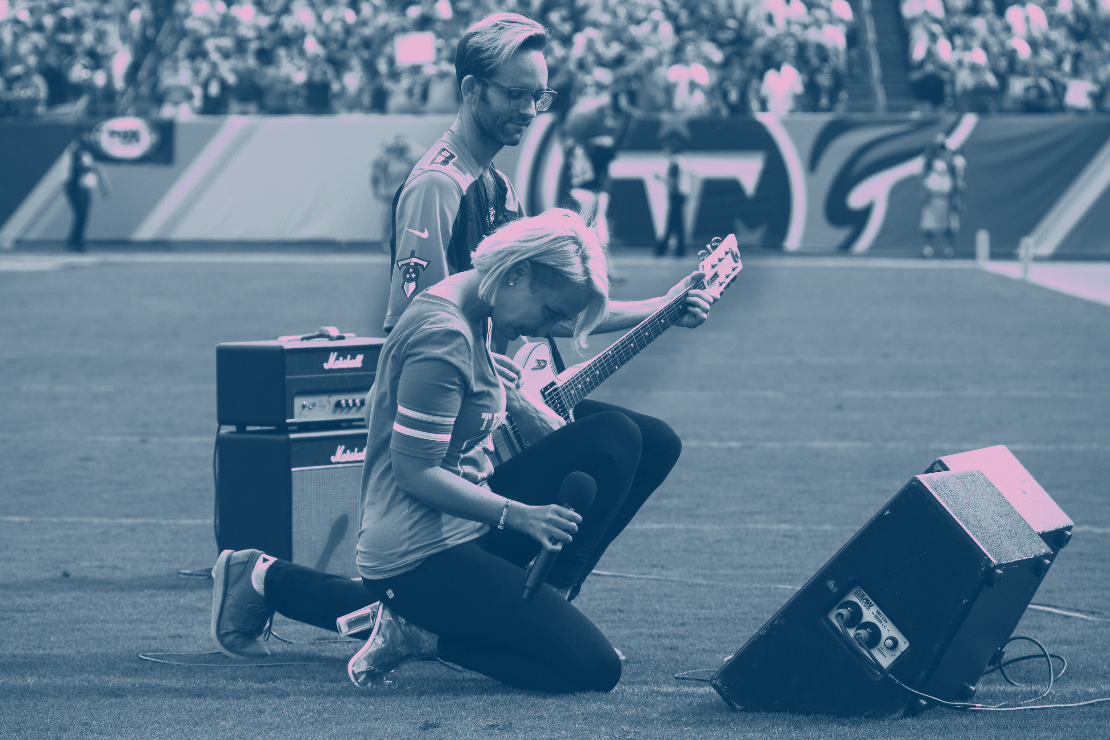 Meghan Linsey takes a knee after performing the national anthem at Nissan Stadium in Nashville, Tennessee, on Sunday, September 24, 2017. CREDIT: AP / Edit by Diana Ofosu