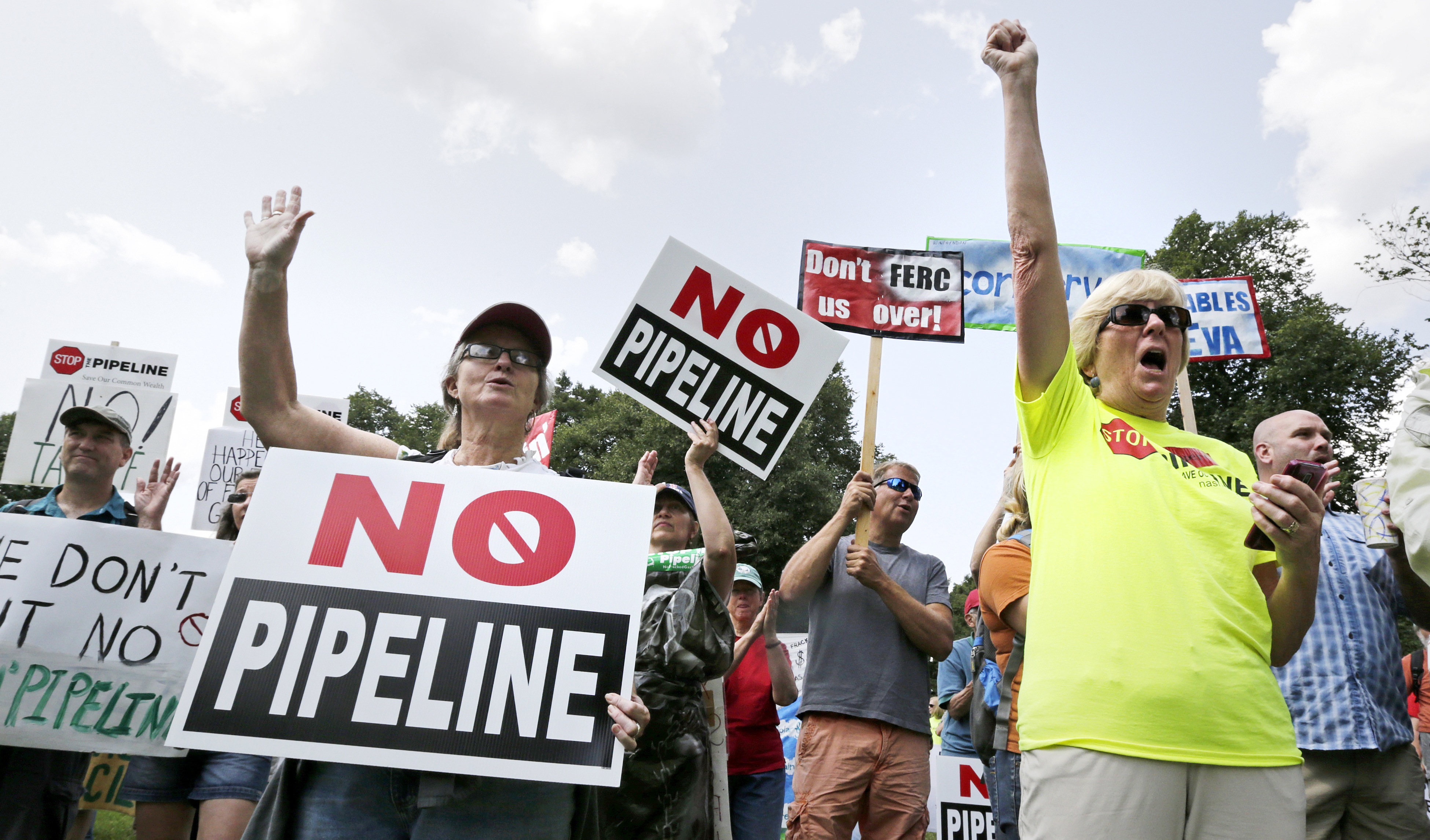 Protesters urge the Federal Energy Regulatory Commission to reject a natural gas pipeline proposed by Kinder Morgan in the U.S. Northeast. CREDIT: AP Photo/Charles Krupa