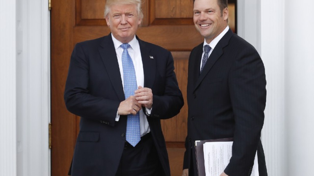 BEFORE A MEETING WITH THEN PRESIDENT-ELECT DONALD TRUMP AT THE TRUMP NATIONAL GOLF CLUB LAST NOVEMBER, AND AP PHOTOGRAPHER CAPTURED KANSAS SECRETARY OF STATE KRIS KOBACH HOLDING A DOCUMENT THAT REFERENCED POSSIBLE CHANGES TO THE NATIONAL VOTER REGISTRATION ACT, AMONG OTHER PLANS. (AP PHOTO/CAROLYN KASTER)