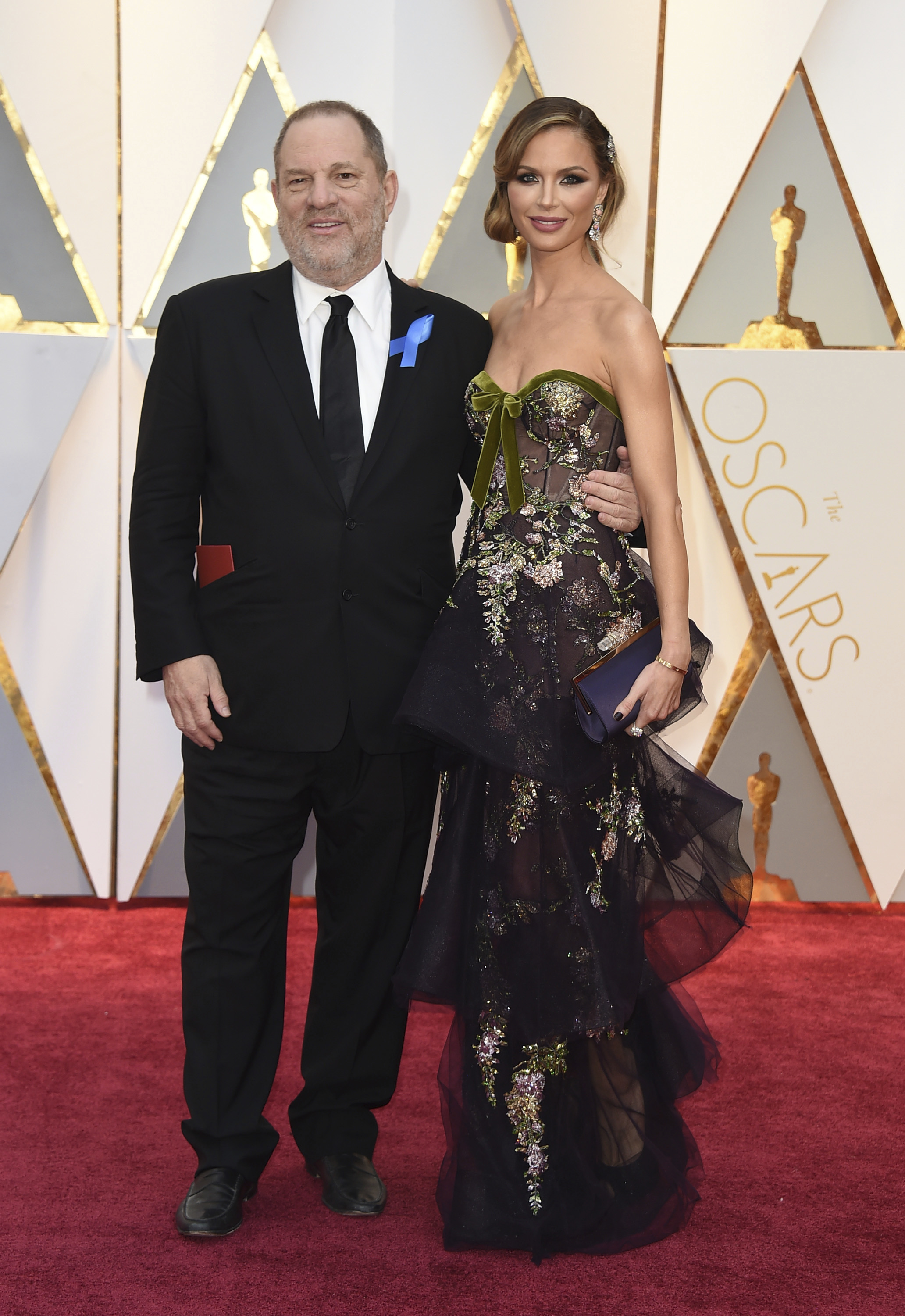 Harvey Weinstein, left, and Georgina Chapman arrive at the Oscars on Sunday, Feb. 26, 2017, at the Dolby Theatre in Los Angeles. CREDIT: Jordan Strauss/Invision/AP