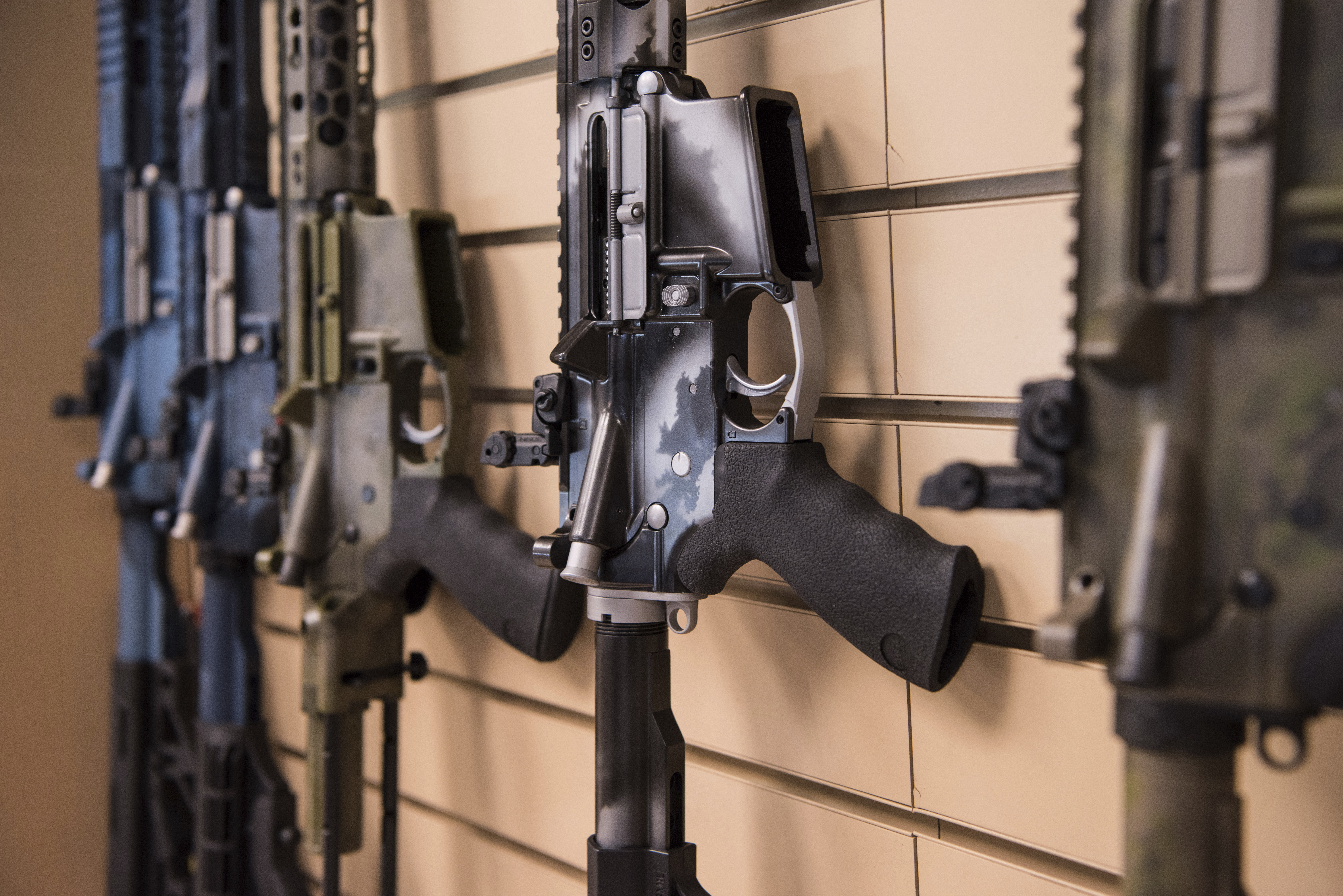 In this photo taken March 15, 2017, AR-15 style rifles made by Battle Rifle Co., a gunmaker in Webster, Texas, are on display in its retail shop. CREDIT: AP Photo/Lisa Marie Pane