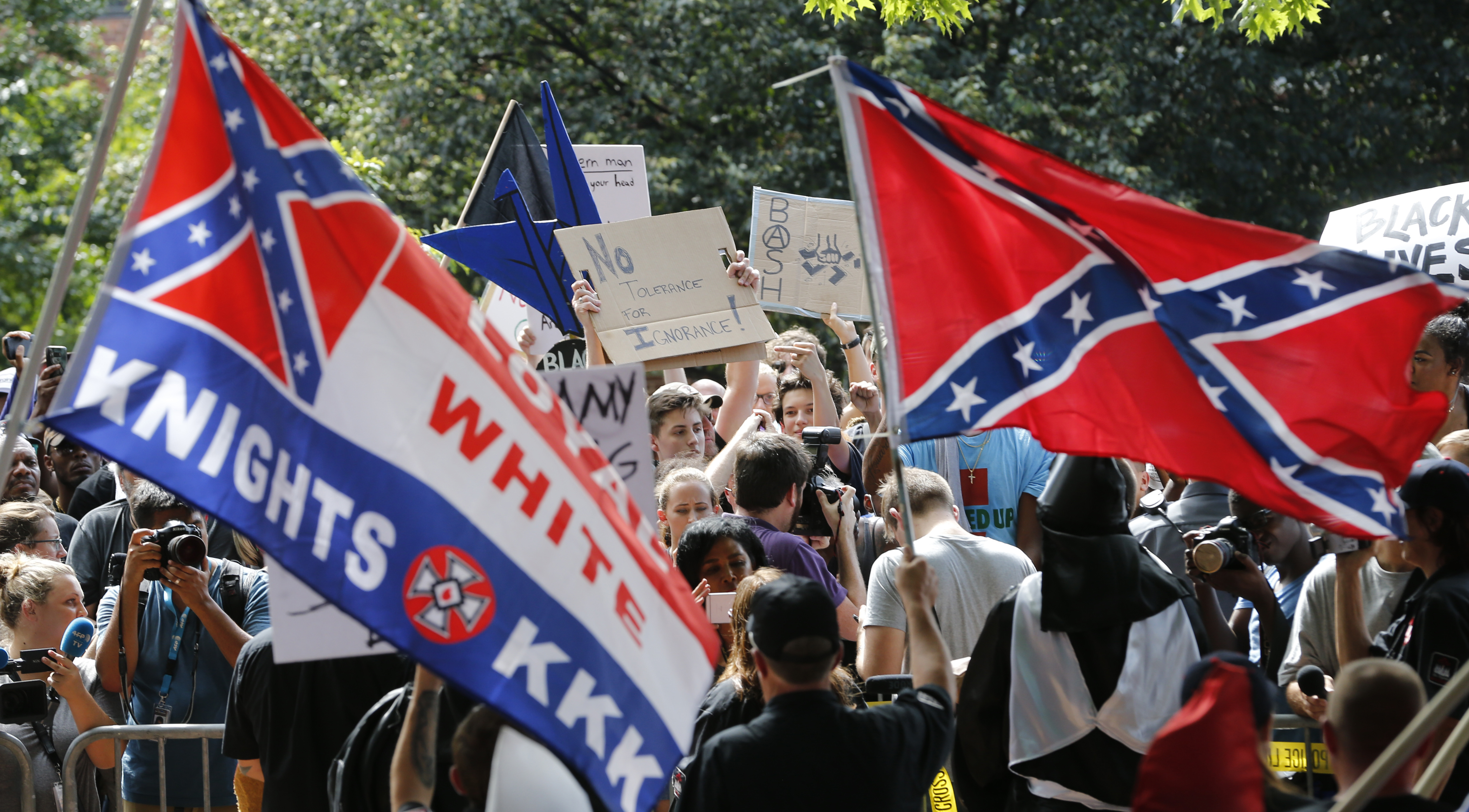 A large group of protesters demonstrate against a KKK rally in Justice Park Saturday, July 8, 2017, in Charlottesville, Va. (AP Photo/Steve Helber)