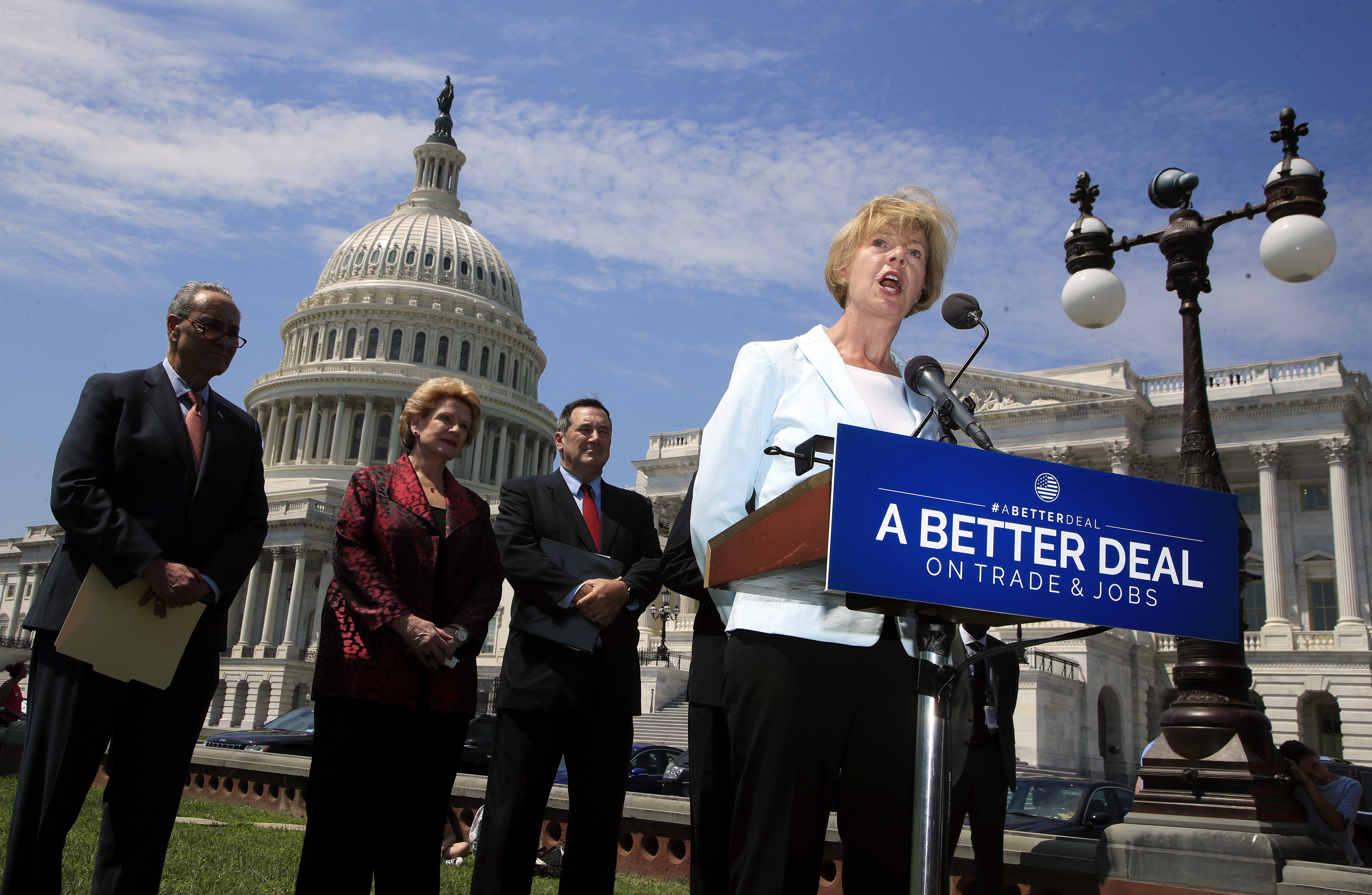 Sen. Tammy Baldwin, D-Wis., right, accompanied by, from left, Senate Minority Leader Chuck Schumer of N.Y., Sen. Debbie Stabenow, D-Mich., and Sen. Bob Casey, D-Pa., speaks on Capitol Hill in Washington, Wednesday, Aug. 2 Credit: (AP Photo/Manuel Balce Ceneta)