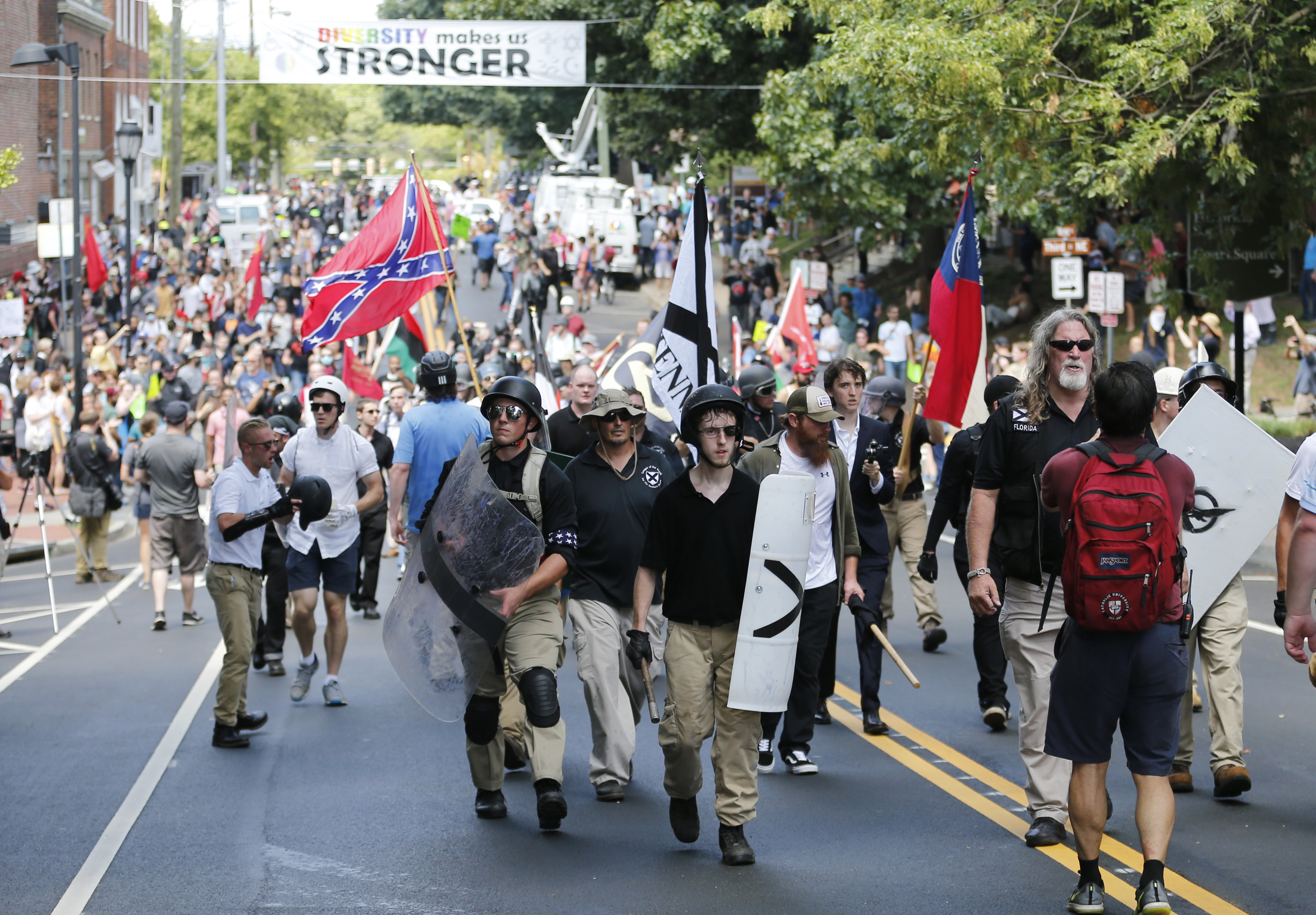 White nationalists arrive in a vanguard to the corner of Emancipation Park in Charlottesville, VA, this August. (CREDIT: AP Photo/Steve Helber)