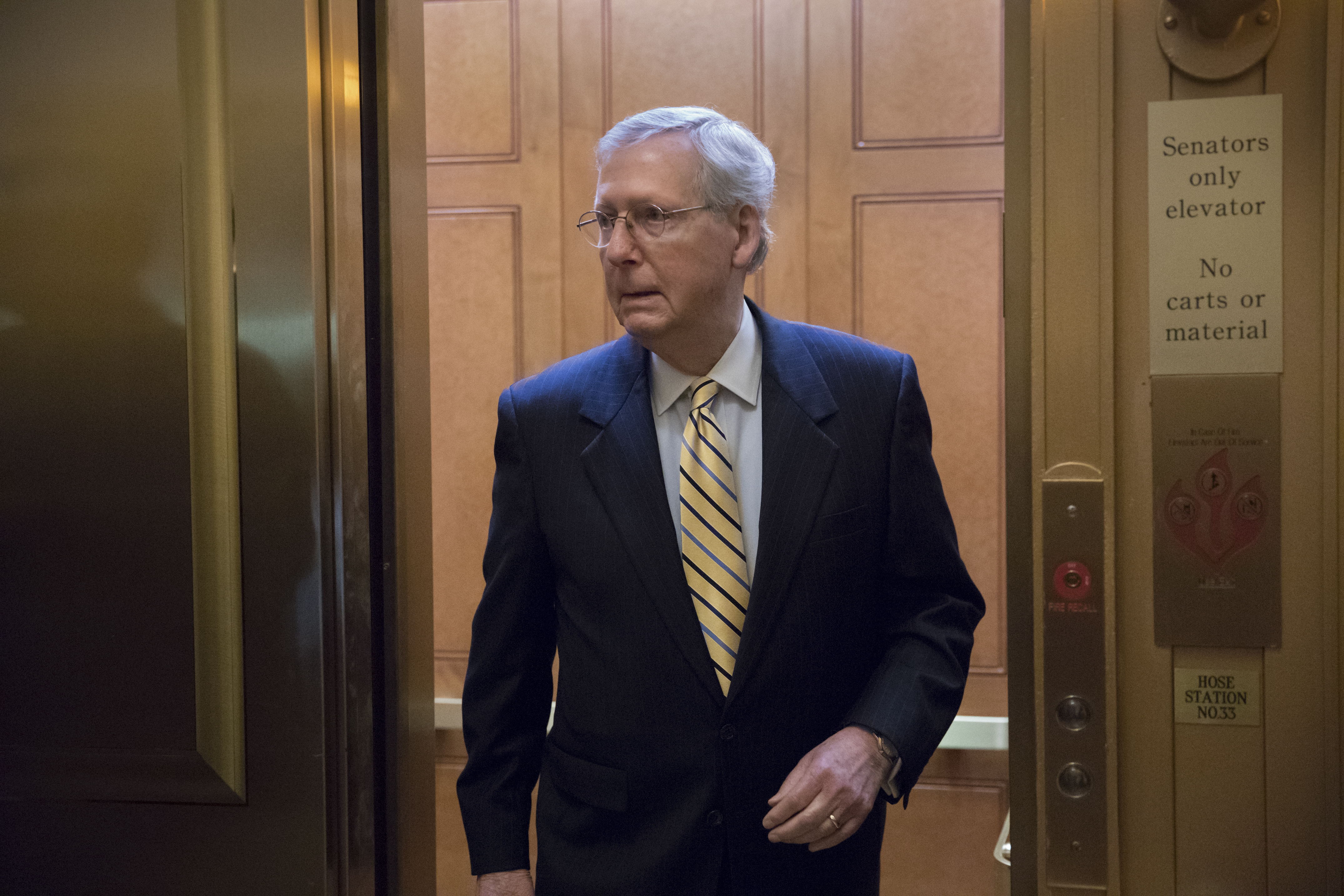 Senate Majority Leader Mitch McConnell, R-Ky, heads to a meeting with Treasury Secretary Steven Mnuchin, Trump's top economic adviser Gary Cohn, and members of the Senate Budget Committee. CREDIT: AP Photo/J. Scott Applewhite