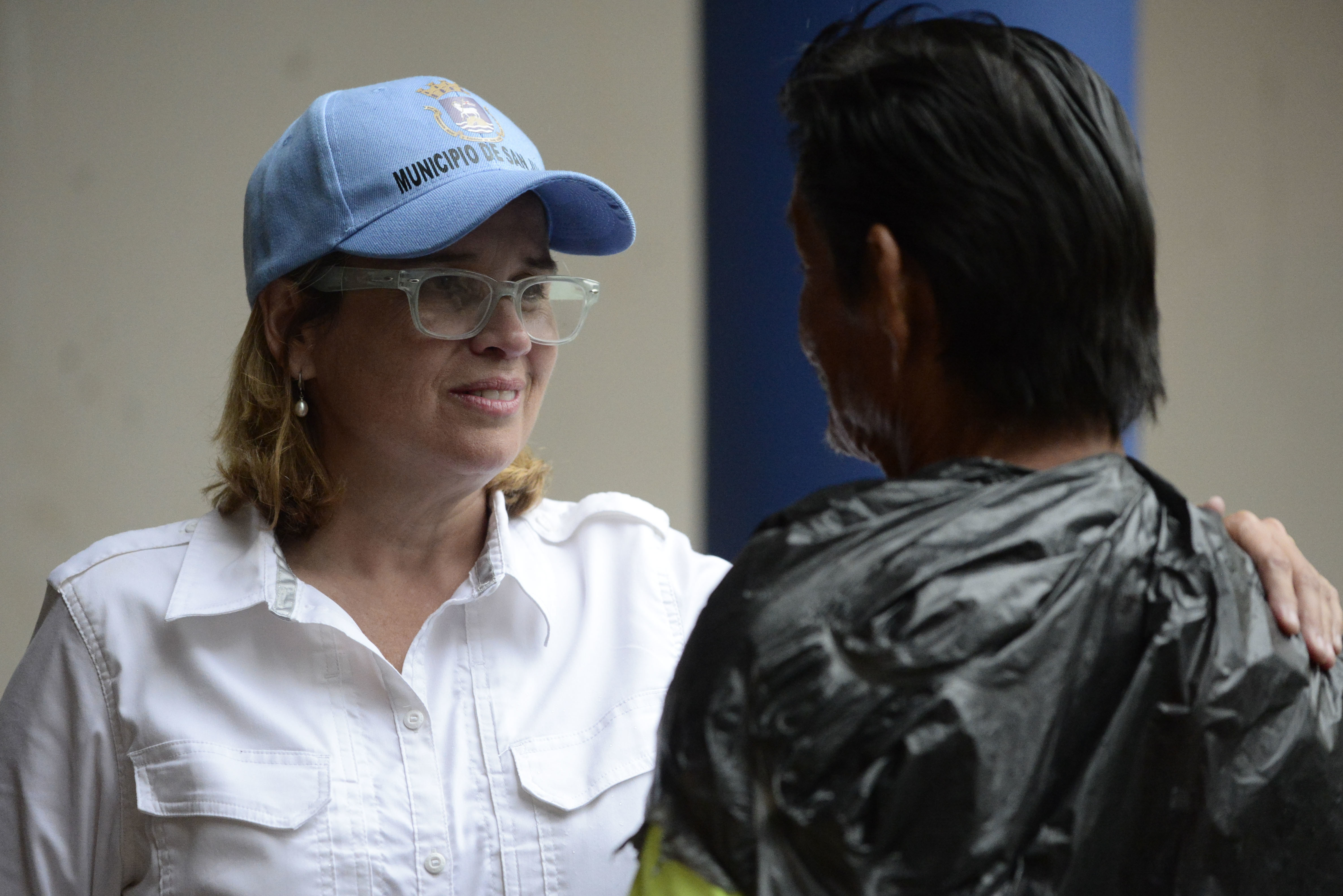 Mayor Carmen Yulin Cruz speaks with a man as she arrives at San Francisco hospital in the Rio Piedras area of San Juan, Puerto Rico.
(AP Photo/Carlos Giusti)