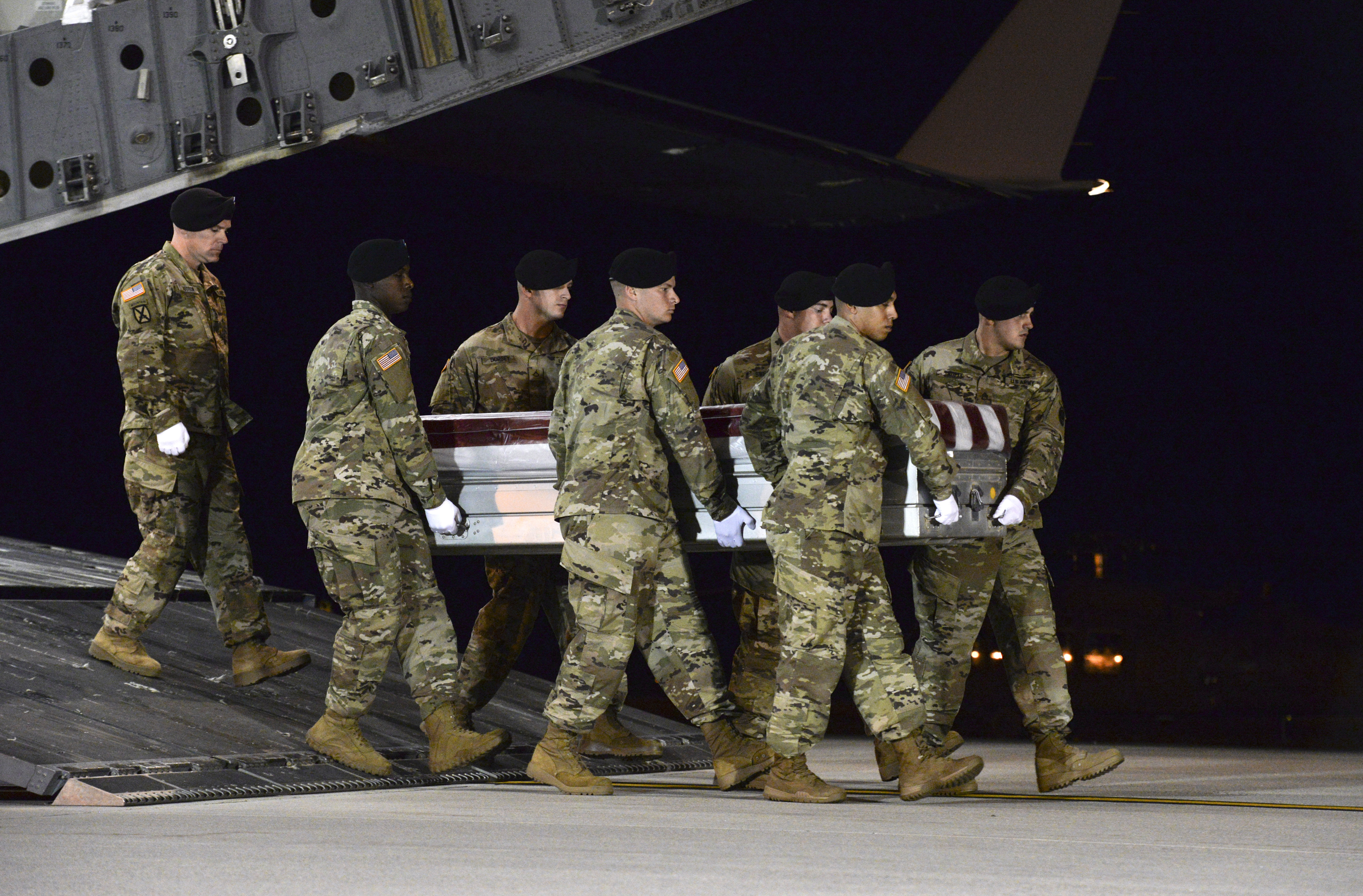 A U.S. Army carry team transfers the remains of Army Staff Sgt. Dustin Wright late Thursday. CREDIT: Staff Sgt. Aaron J. Jenne/U.S. Air Force via AP
