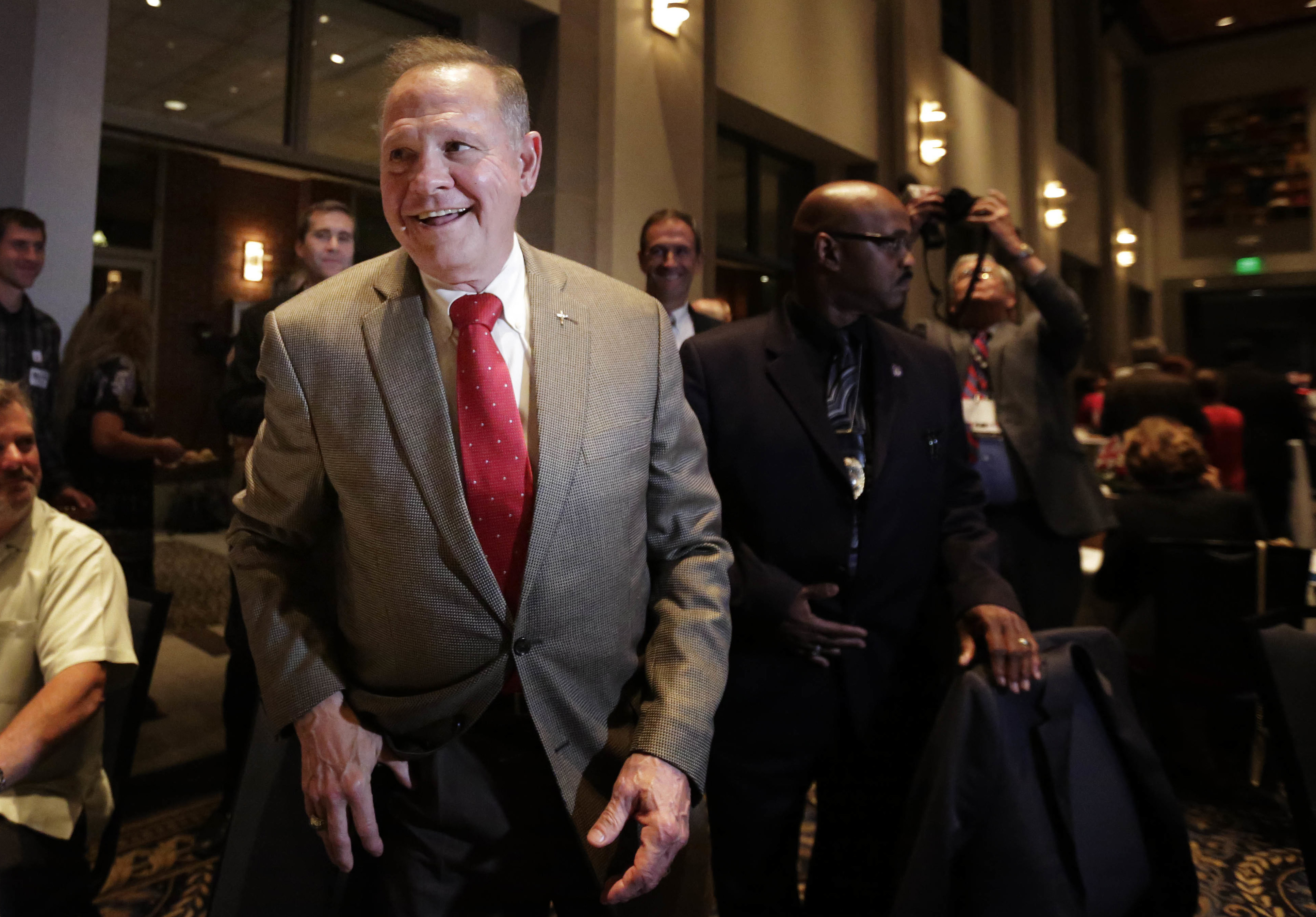 In this Sept. 26, 2017, file photo, former Alabama Chief Justice and U.S. Senate candidate Roy Moore greets supporters before his election party. CREDIT: AP Photo/Brynn Anderson, File