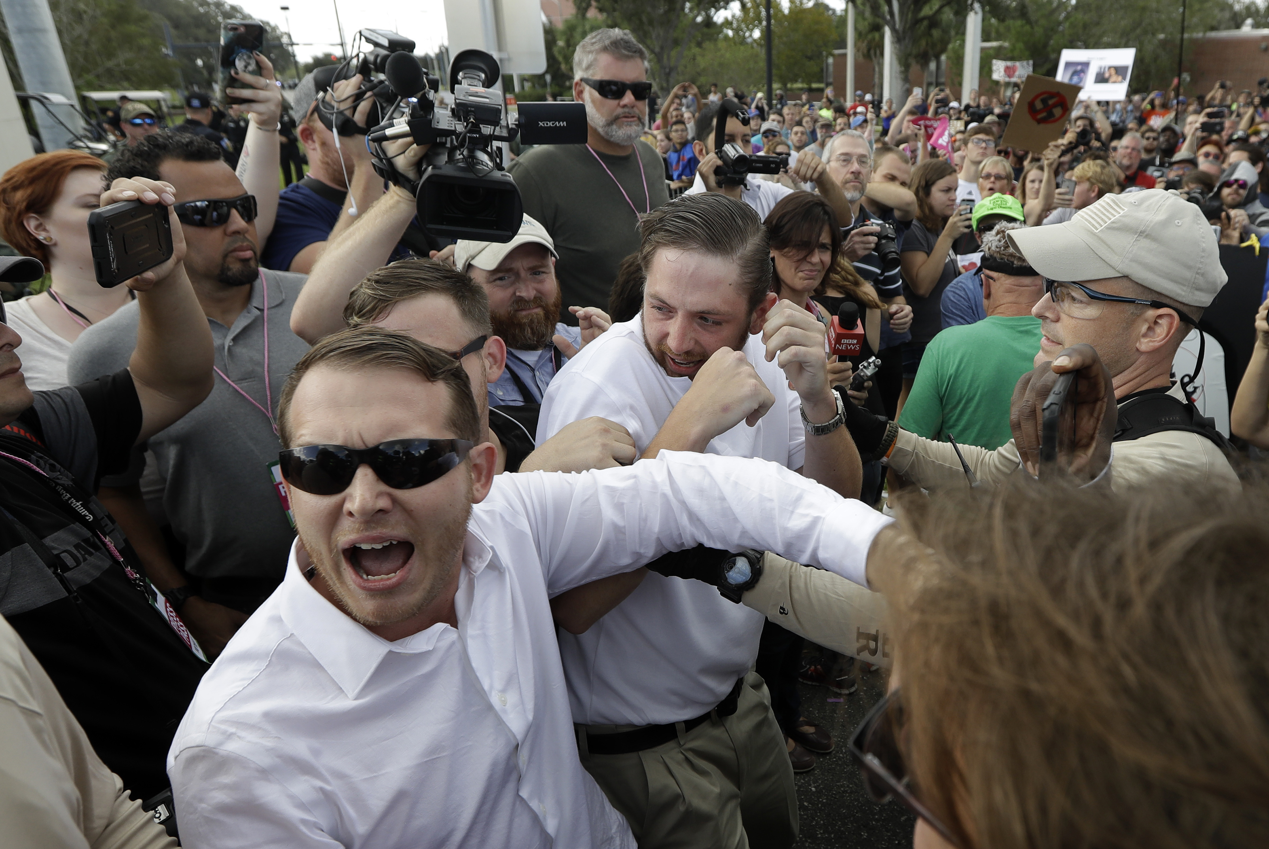Two supporters of Richard Spencer clash with protesters after Spencer spoke at the University of Florida. (AP Photo/Chris O'Meara)