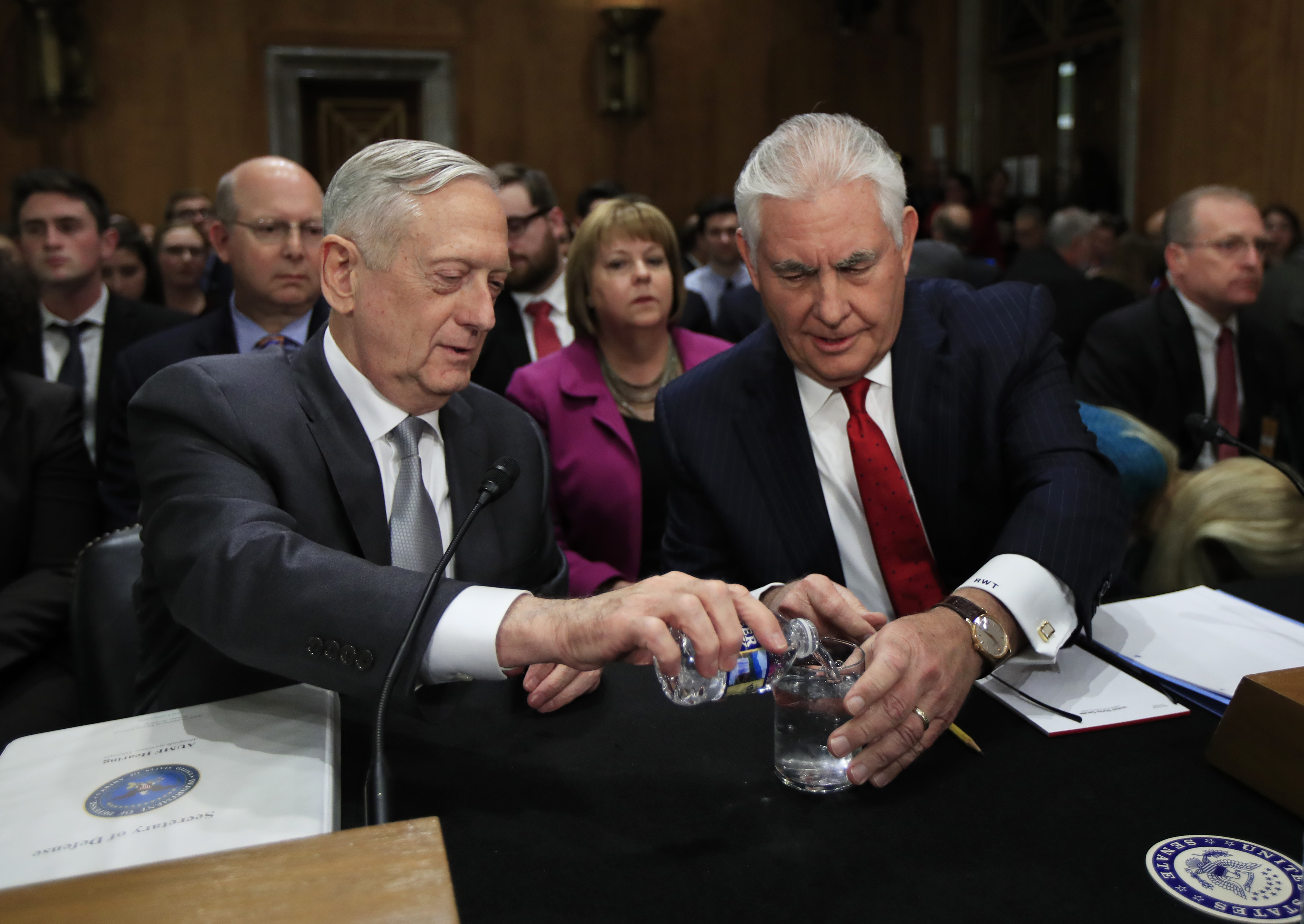 Secretary of Defense Jim Mattis, left, pours drinking water for Secretary of State Rex Tillerson at the start of a Senate Foreign Relations Committee hearing on "The Authorizations for the Use of Military Force: Administration Perspective" on Capitol Hill in Washington, Monday, Oct. 30, 2017. CREDIT: AP Photo/Manuel Balce Ceneta