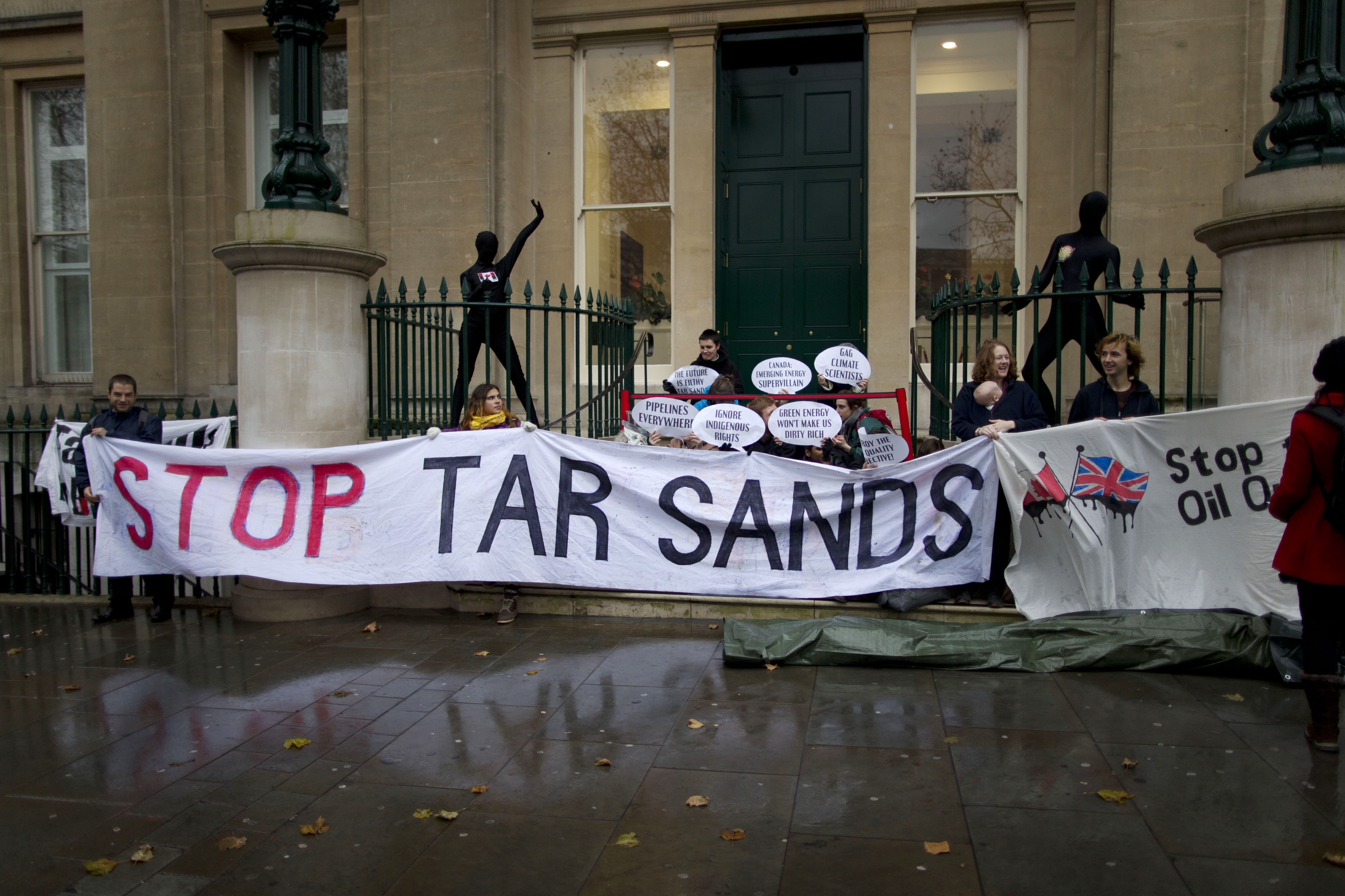 Environmental protesters against the tar sands industry attempt to blockade the annual Canada Europe Energy Summit with a performance-style demonstration outside Canada House by Trafalgar Square in London, Tuesday, Nov. 20, 2012. CREDIT: AP Photo/Matt Dunham