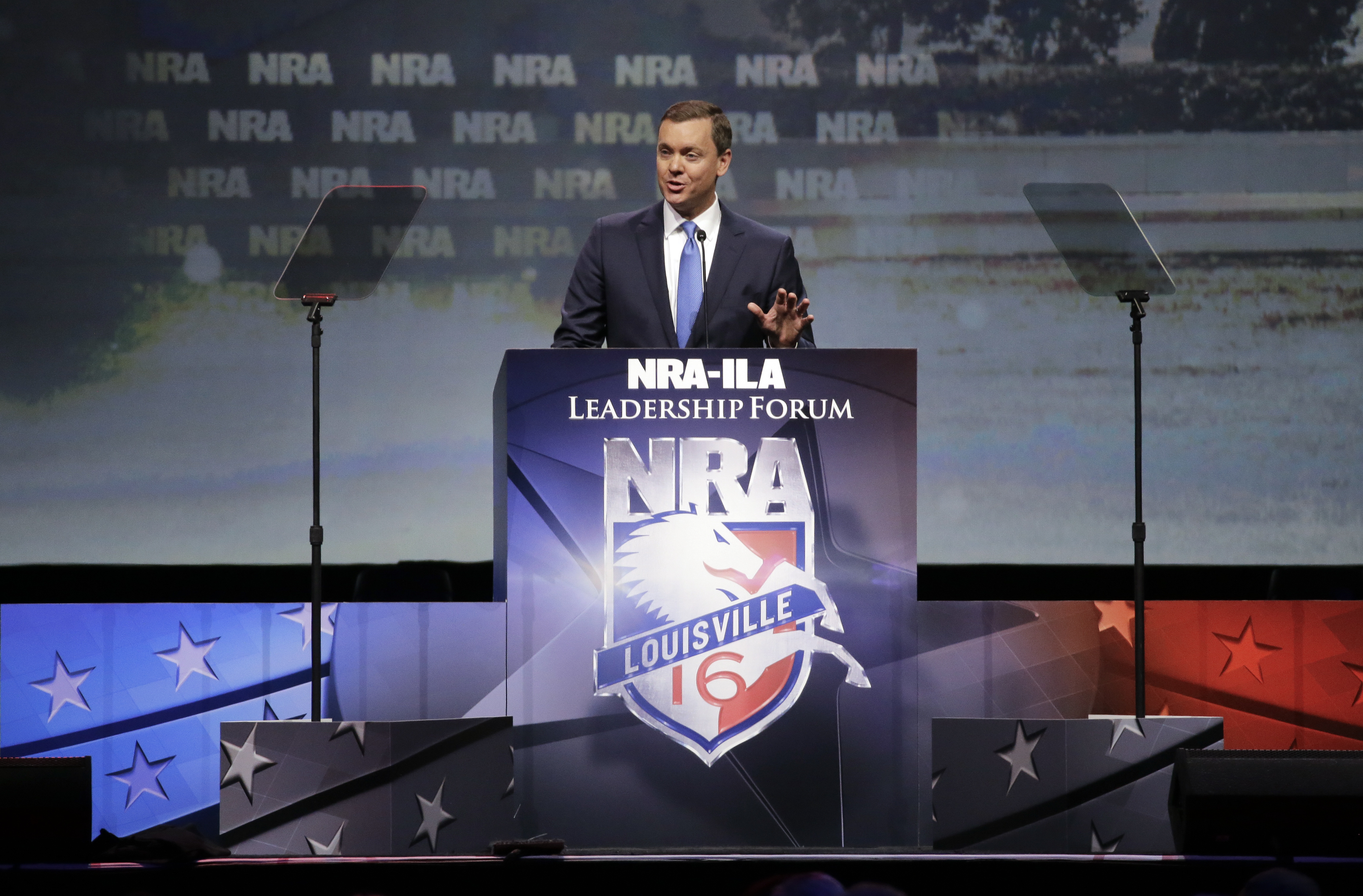 National Rifle Association executive director Chris W. Cox speaks at the National Rifle Association convention Saturday, May 21, 2016, in Louisville, Ky. (AP Photo/Mark Humphrey)