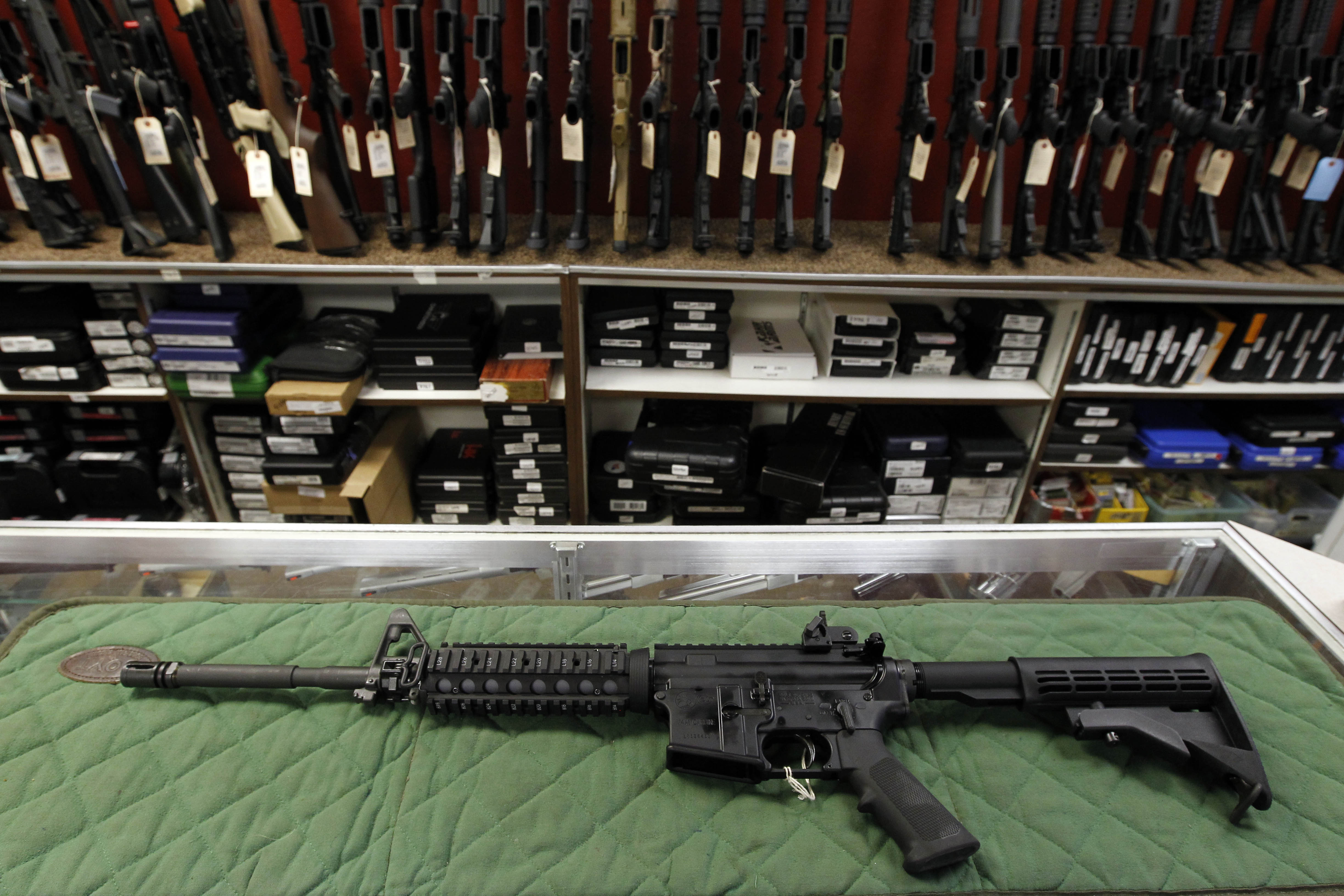 FILE - In this Thursday, July 26, 2012 file photo, an AR-15 style rifle is displayed at the Firing-Line indoor range and gun shop in Aurora, Colo. (AP Photo/Alex Brandon, File)