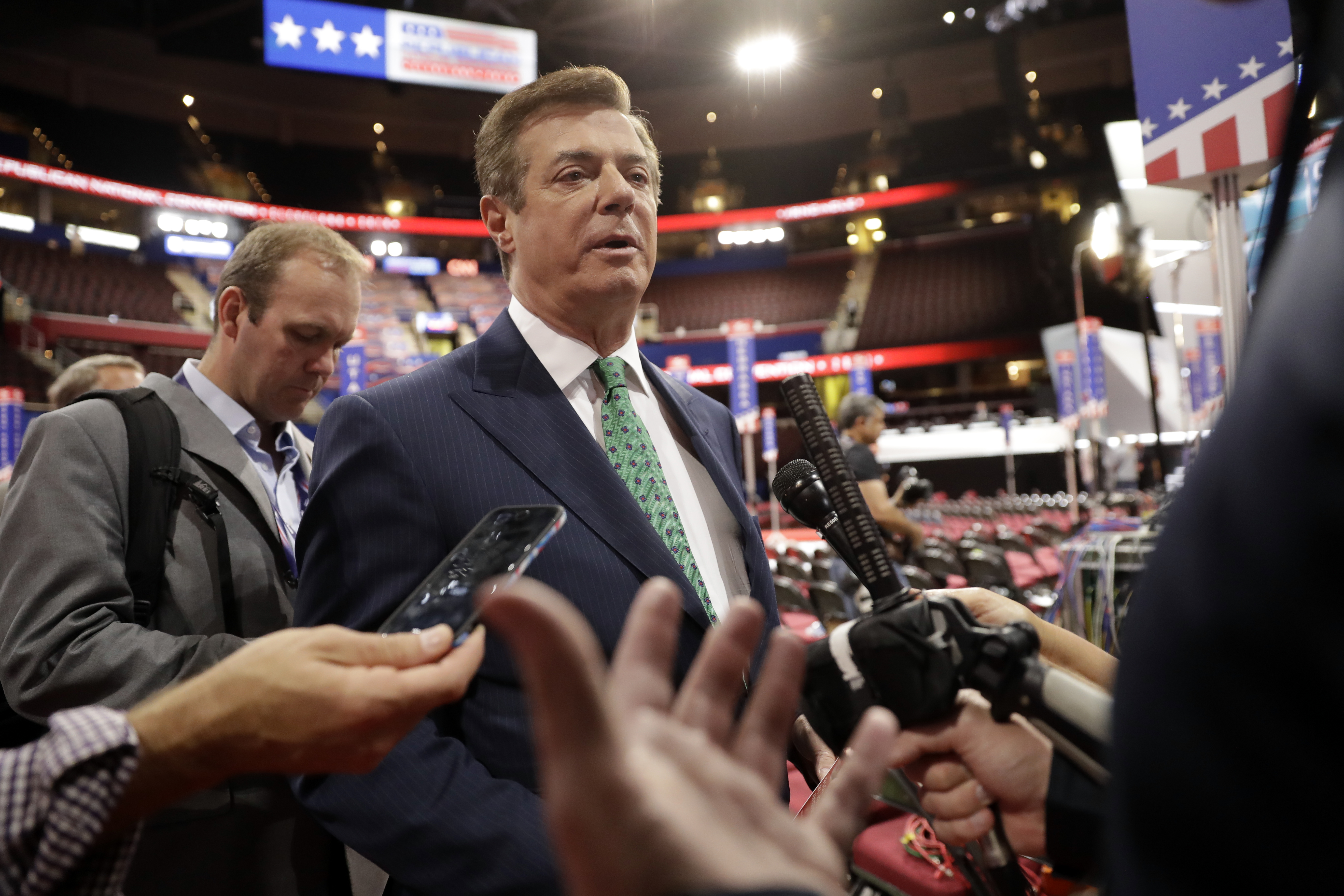 Former Trump Campaign Chairman Paul Manafort is surrounded by reporters on the floor of the Republican National Convention at Quicken Loans Arena, Sunday, July 17, 2016, in Cleveland. CREDIT: Matt Rourke/AP Photo.