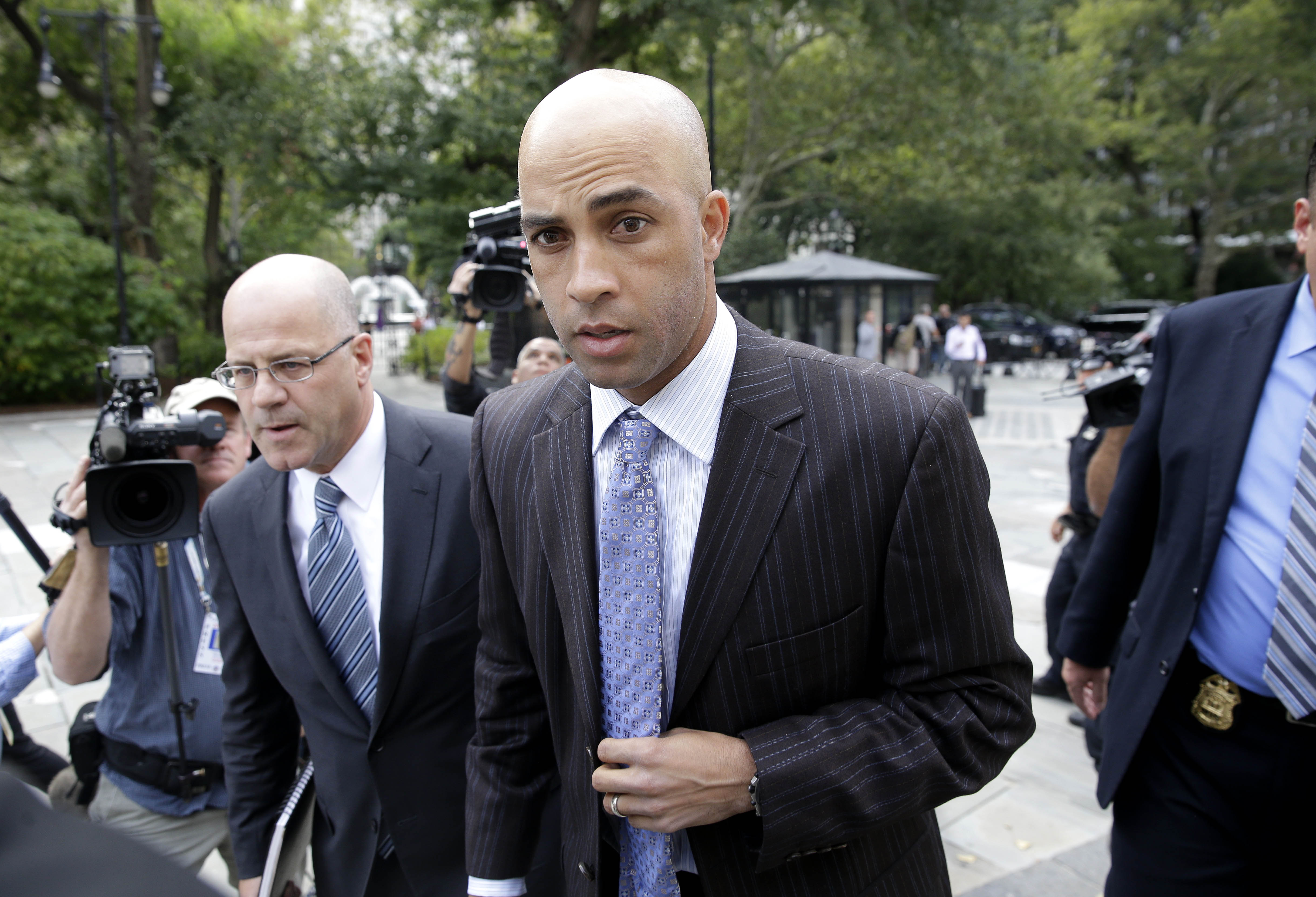 James Blake arrives to city hall in New York, Monday, Sept. 21, 2015. Blake, the former tennis star who was tackled during a mistaken arrest by a New York City police officer plans to meet with Mayor Bill de Blasio and Police Commissioner William Bratton according to his spokeswoman. (AP Photo/Seth Wenig)