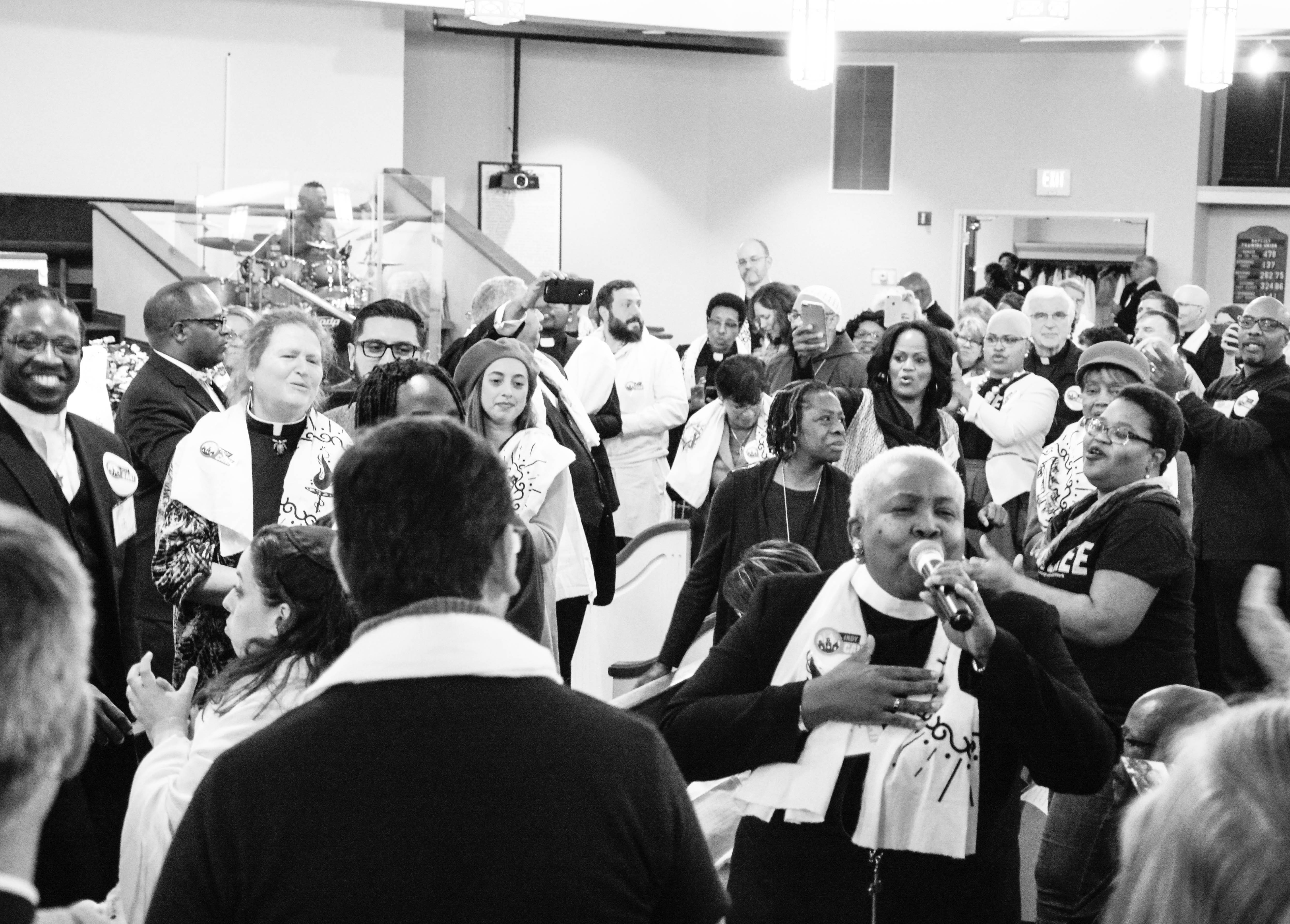 Conference attendees sing hymns as part of the Prophetic Resistance Summit. (CREDIT: Jack Jenkins/ThinkProgress)