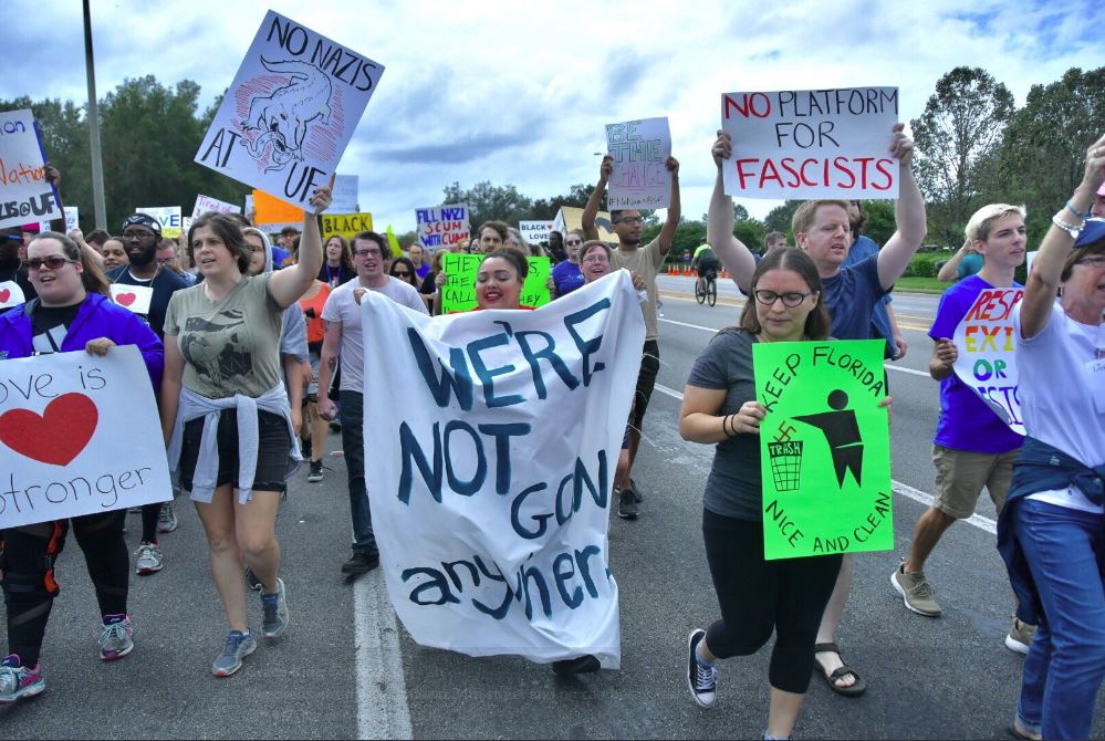 Hundreds of people march down 34th street on the University of Florida campus Thursday. CREDIT: Grace King/WUFT News
