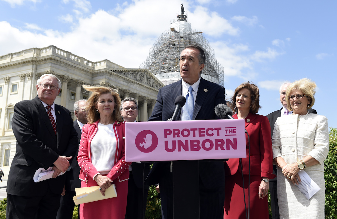 Rep. Trent Franks, R-Ariz., center, speaks during a news conference on the Pain-Capable Unborn Child Protection Act on Capitol Hill in Washington, Wednesday, May 13, 2015. CREDIT: AP/Susan Walsh