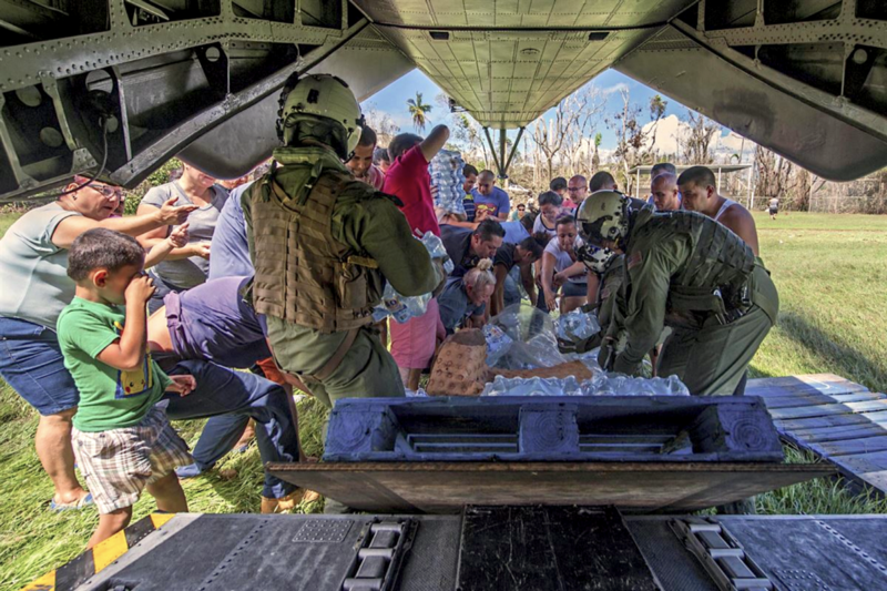U.S. sailors deliver water to Puerto Rico after Hurricane Maria. CREDIT: Department of Defense