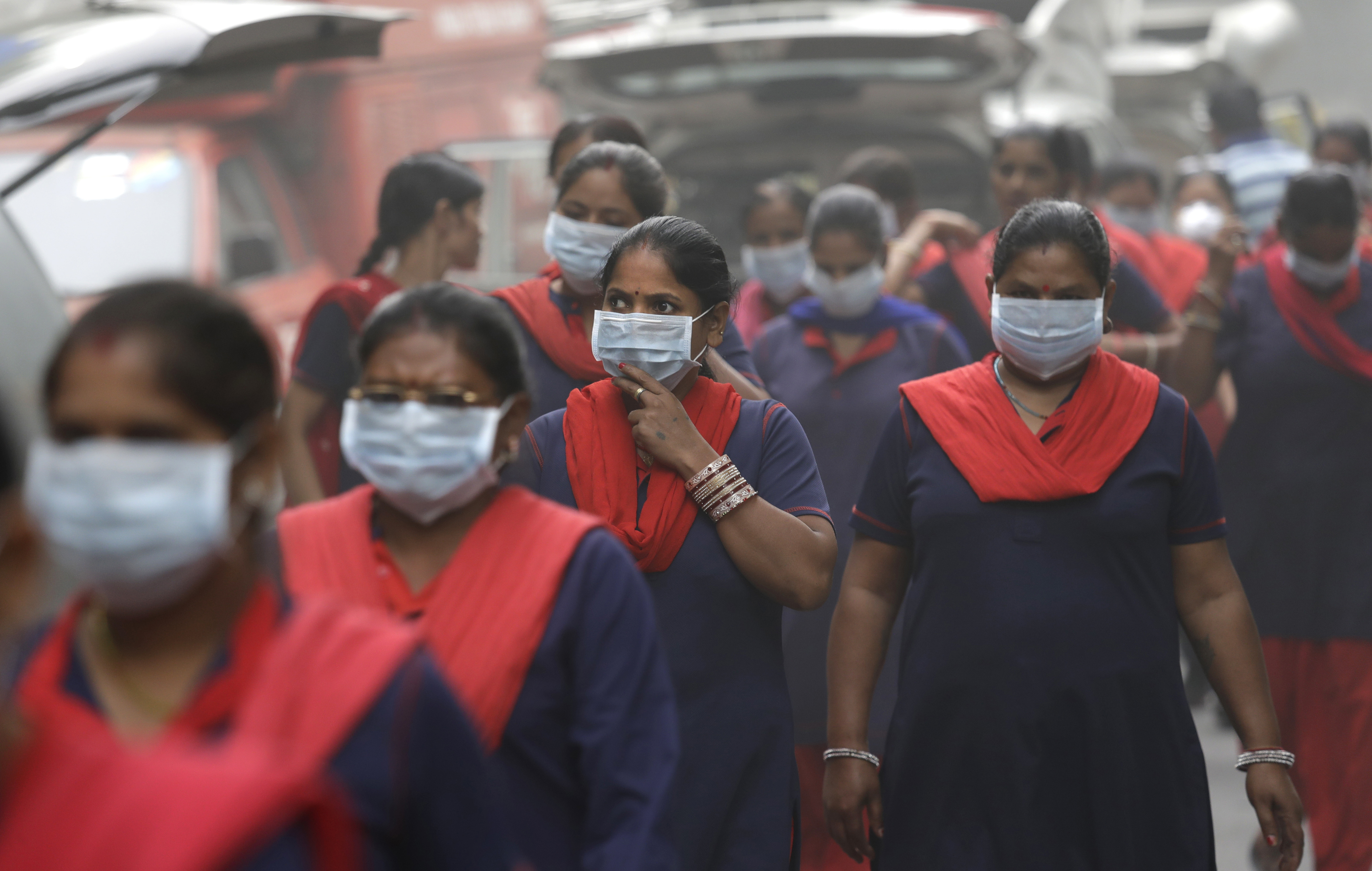 A group of Indian women wear pollution masks arrive to a protest against air pollution in New Delhi, India, Sunday, Nov. 6, 2016. CREDIT: AP Photo/Manish Swarup