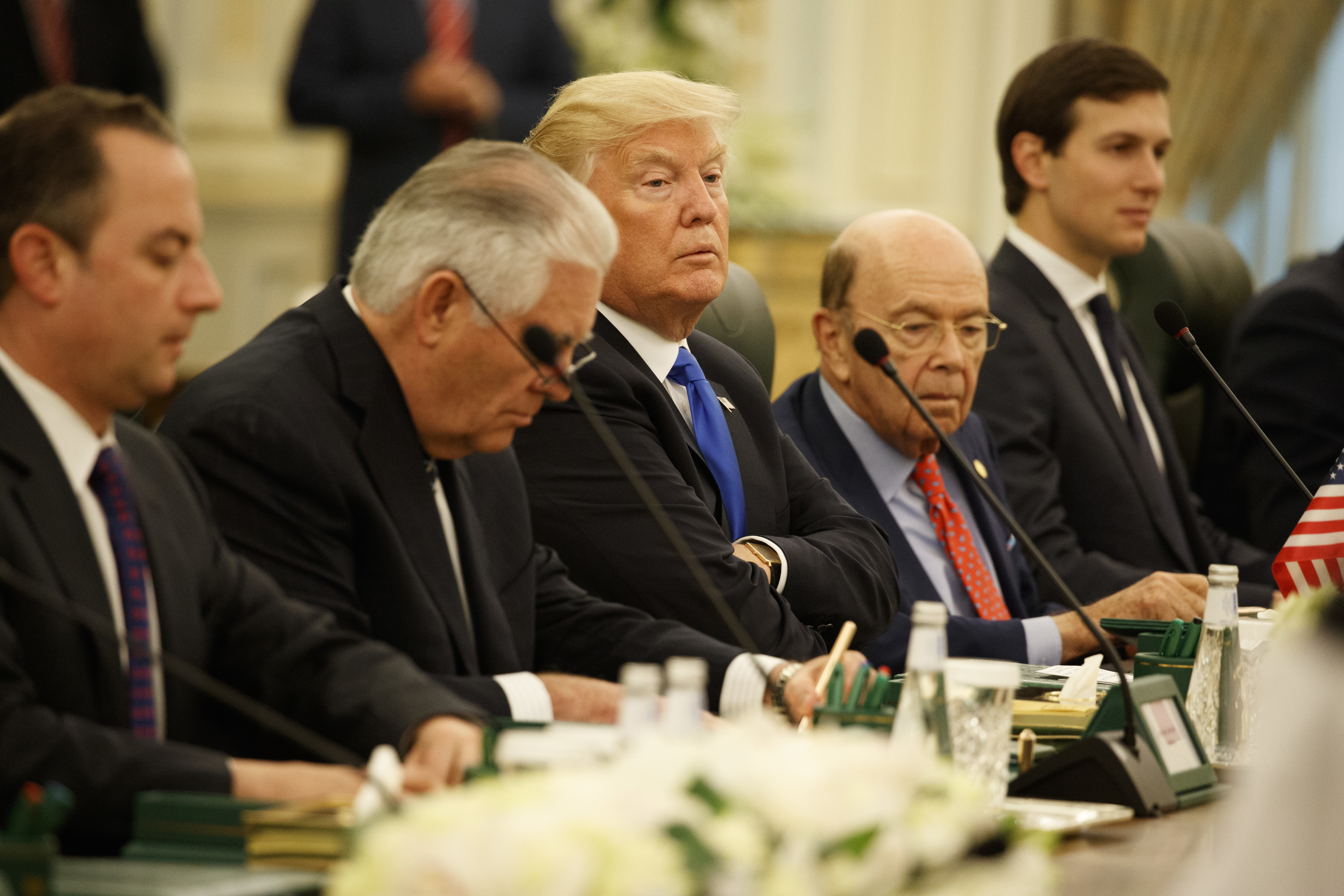 Both Secretary of State Rex Tillerson (left of Trump) and Commerce Secretary Wilbur Ross (right of Trump) have been named in the Paradise Papers leak. (AP Photo/Evan Vucci)