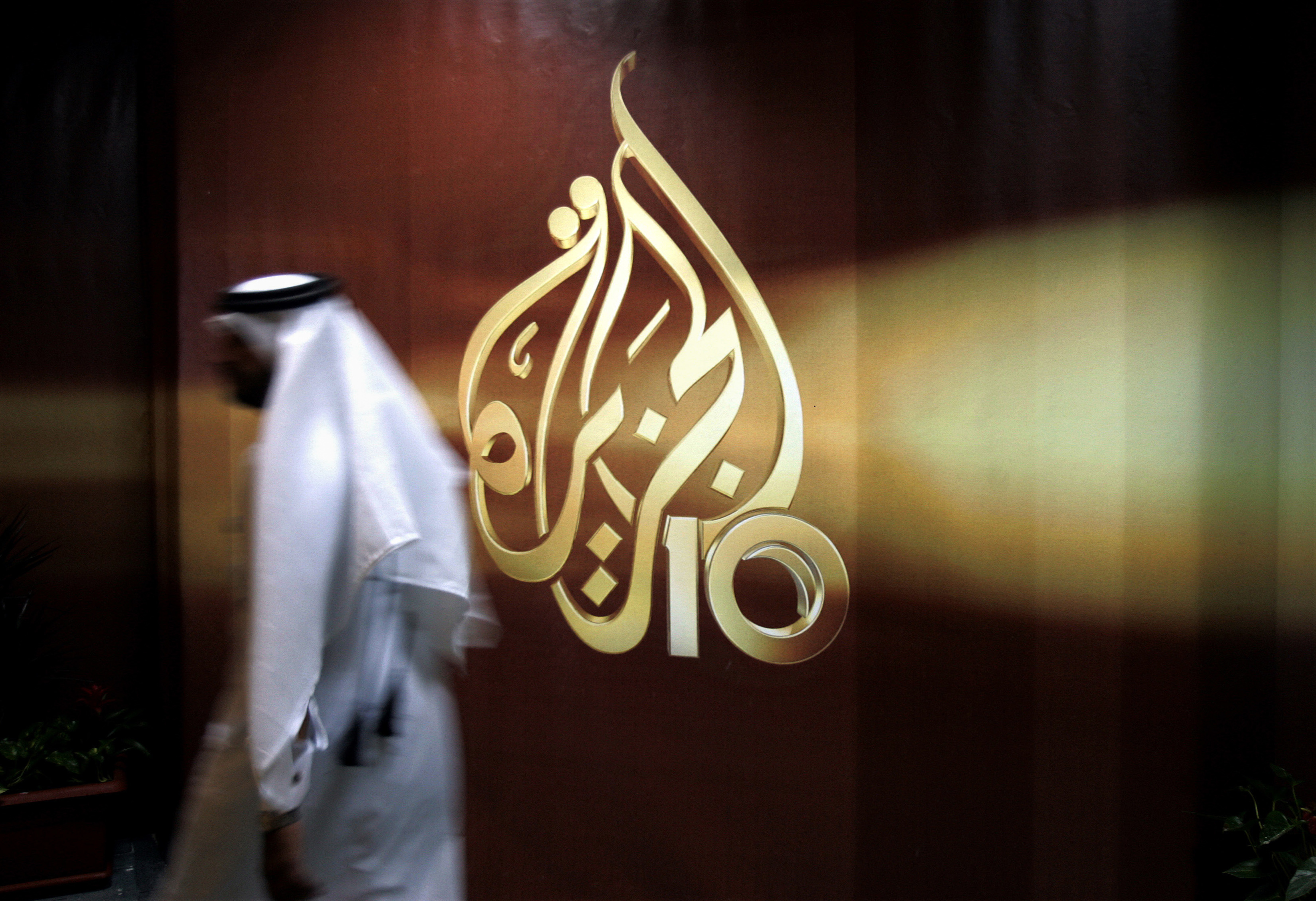 Hackers allegedly broke into the website of Qatar's state-run Al Jazeera news agency and published a fake story quoting the ruling emir, authorities there said Wednesday, May 24, 2017, as Saudi Arabia and the United Arab Emirates responded by blocking Qatari media. CREDIT: Kamran Jebreili/AP Photo.
