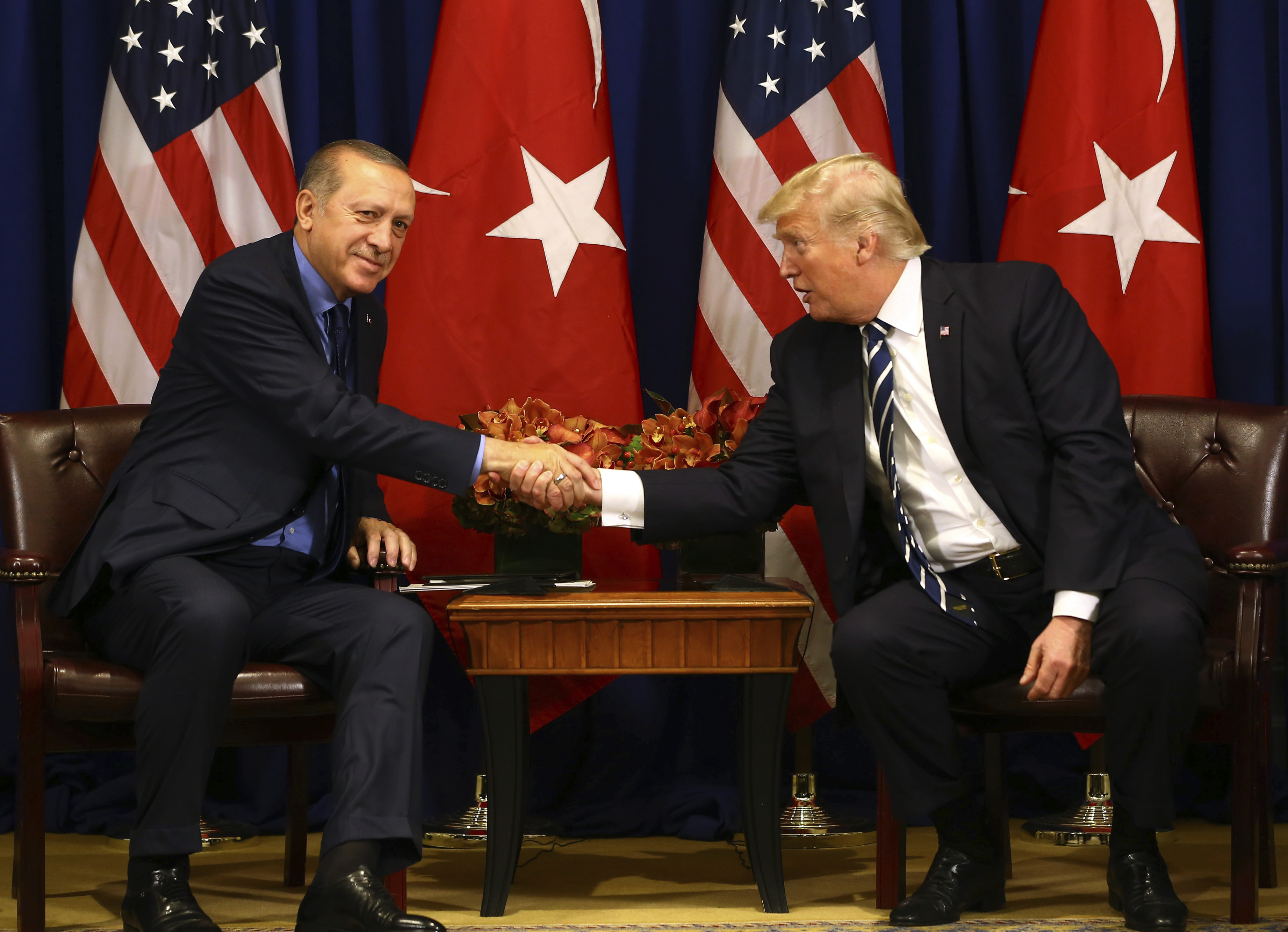 Turkey's President Recep Tayyip Erdogan, left, and US President Donald Trump shake hands prior to their meeting in New York, Thursday, Sept. 21, 2017. Erdogan is in New York for the United Nations General Assembly. (Pool Photo via AP)