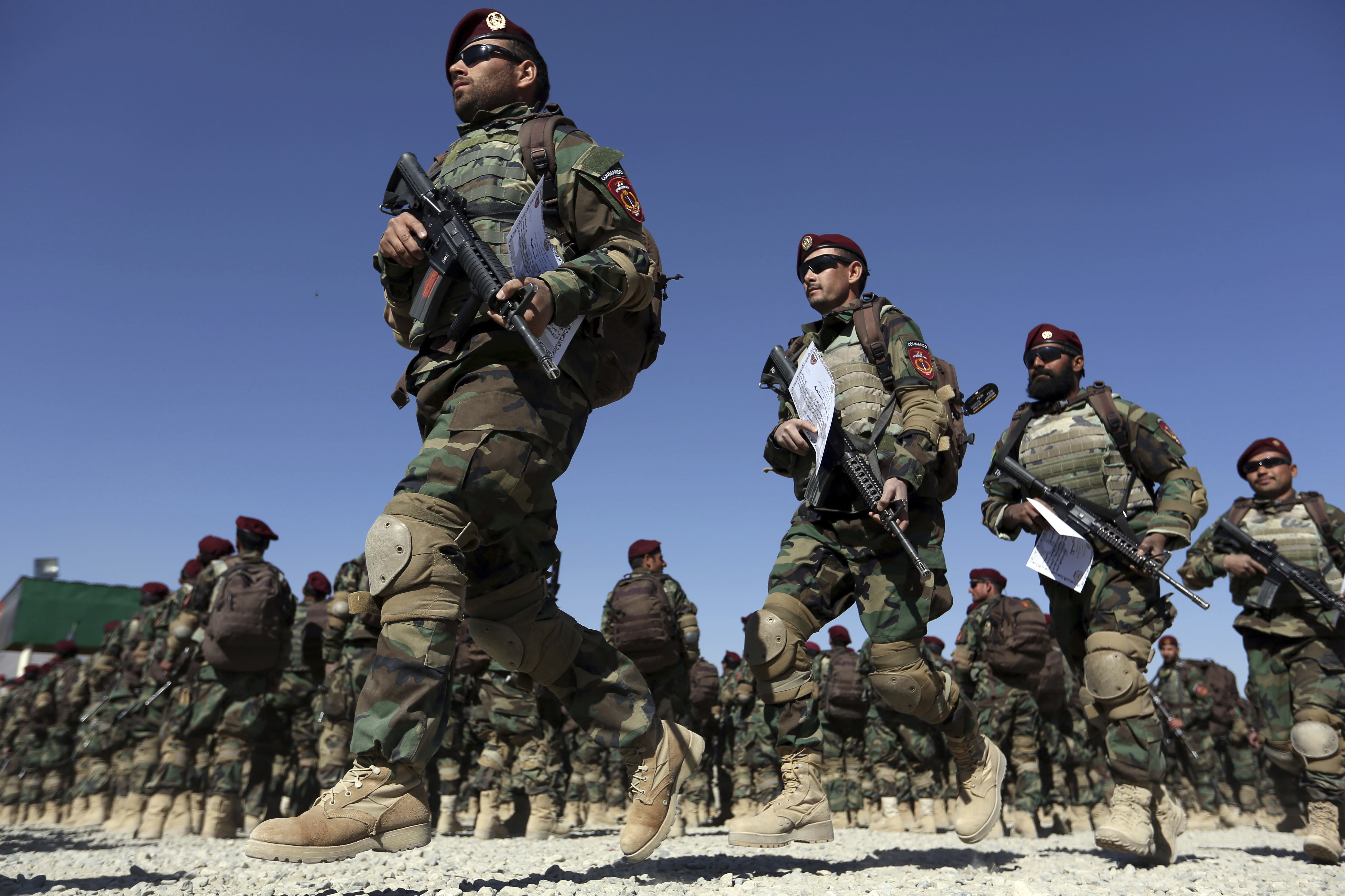 New members of the Afghan Special forces march during their graduation ceremony at the Afghan Corp, on the outskirts of Kabul, Afghanistan. (credit: AP Photo/Rahmat Gul)