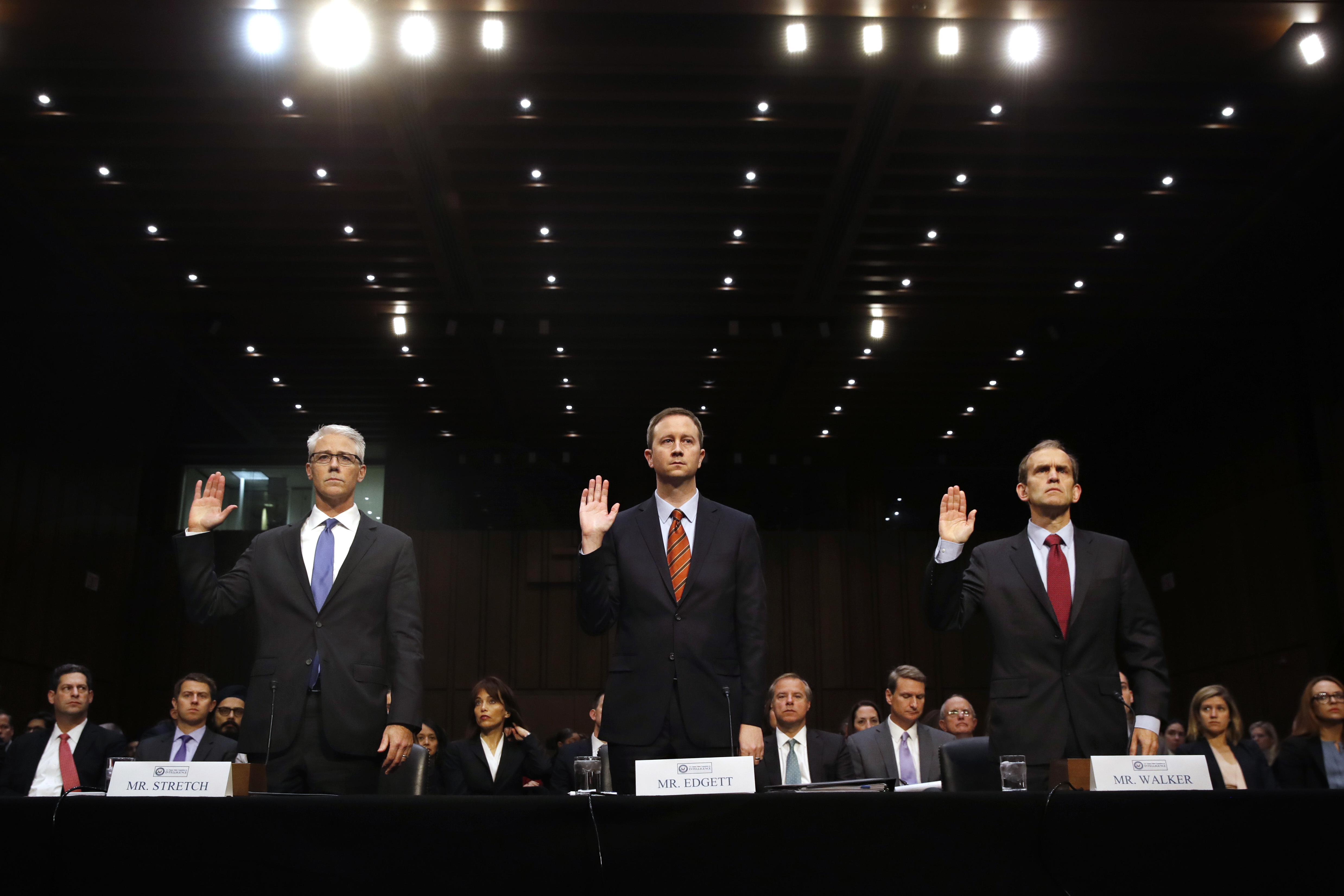 From left, Facebook's General Counsel Colin Stretch, Twitter's Acting General Counsel Sean Edgett, and Google's Senior Vice President and General Counsel Kent Walker, are sworn in for a Senate Intelligence Committee hearing on Russian election activity and technology, Wednesday, Nov. 1, 2017, on Capitol Hill in Washington. (AP Photo/Jacquelyn Martin)