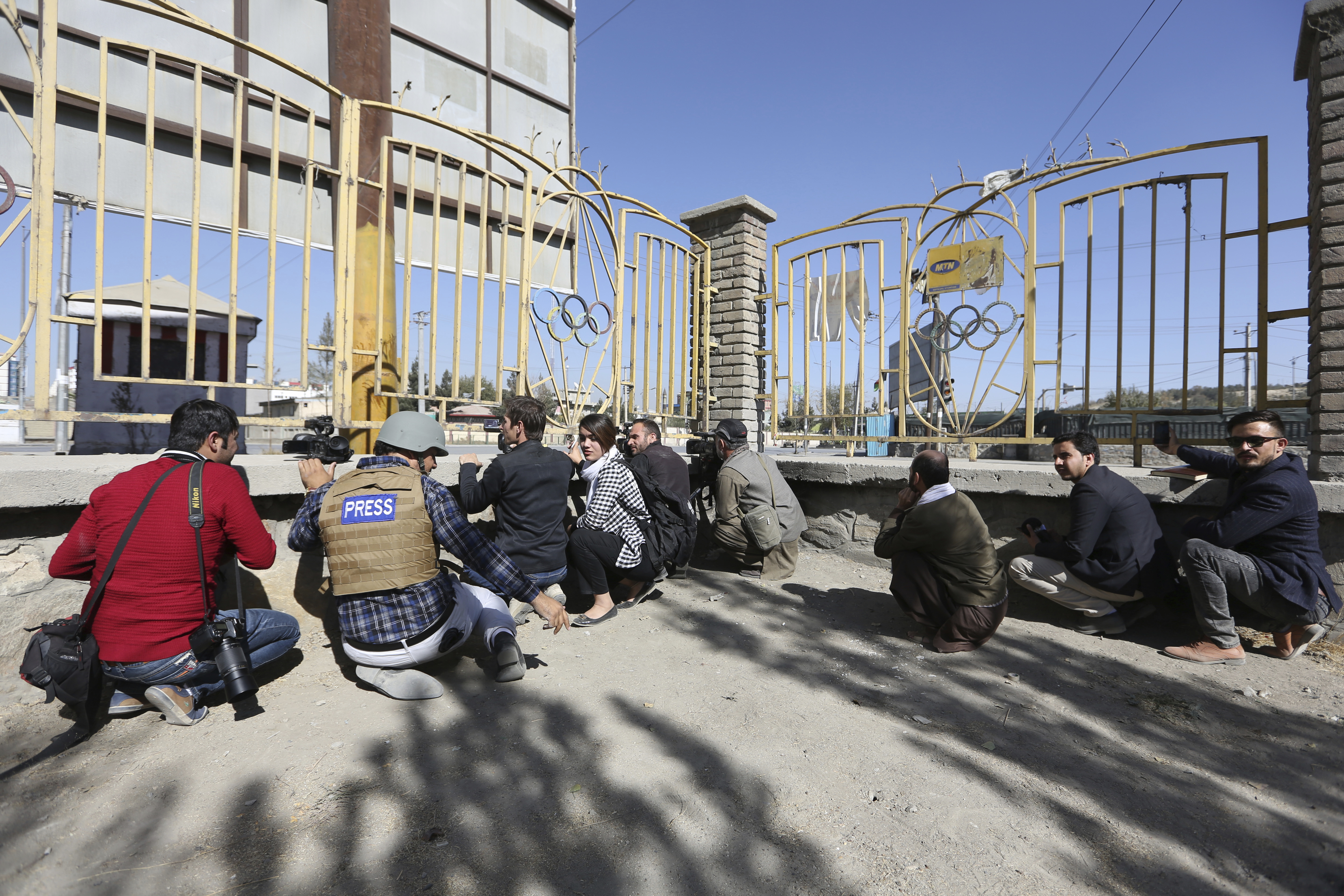 Afghan journalists take photographs at the site of a deadly attack on the Shamshad TV building in Kabul, Afghanistan. (CREDIT: AP Photo/Rahmat Gul)