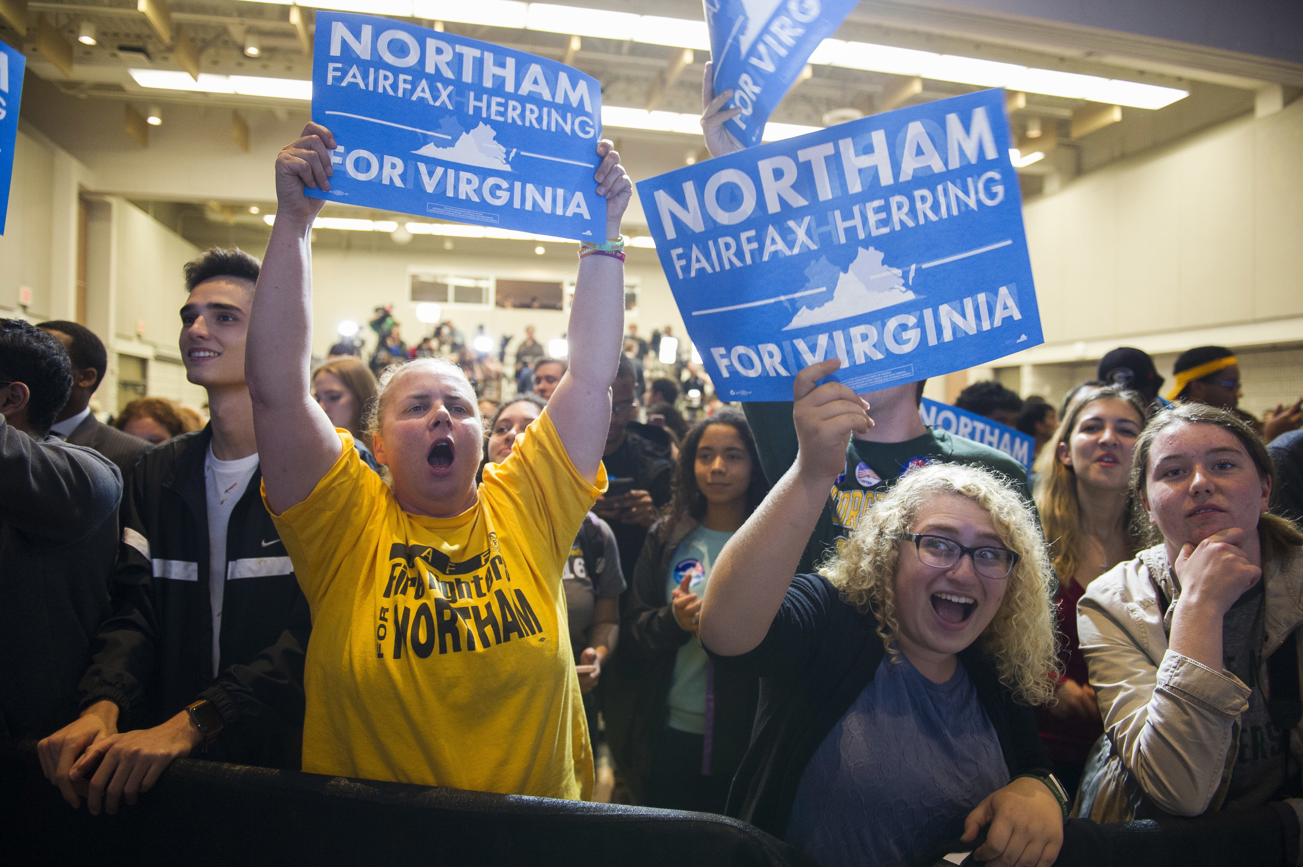 Supporters celebrate news that Democrat Ralph Northam has won the Virginia gubernatorial election. CREDIT: AP Photo/Cliff Owen