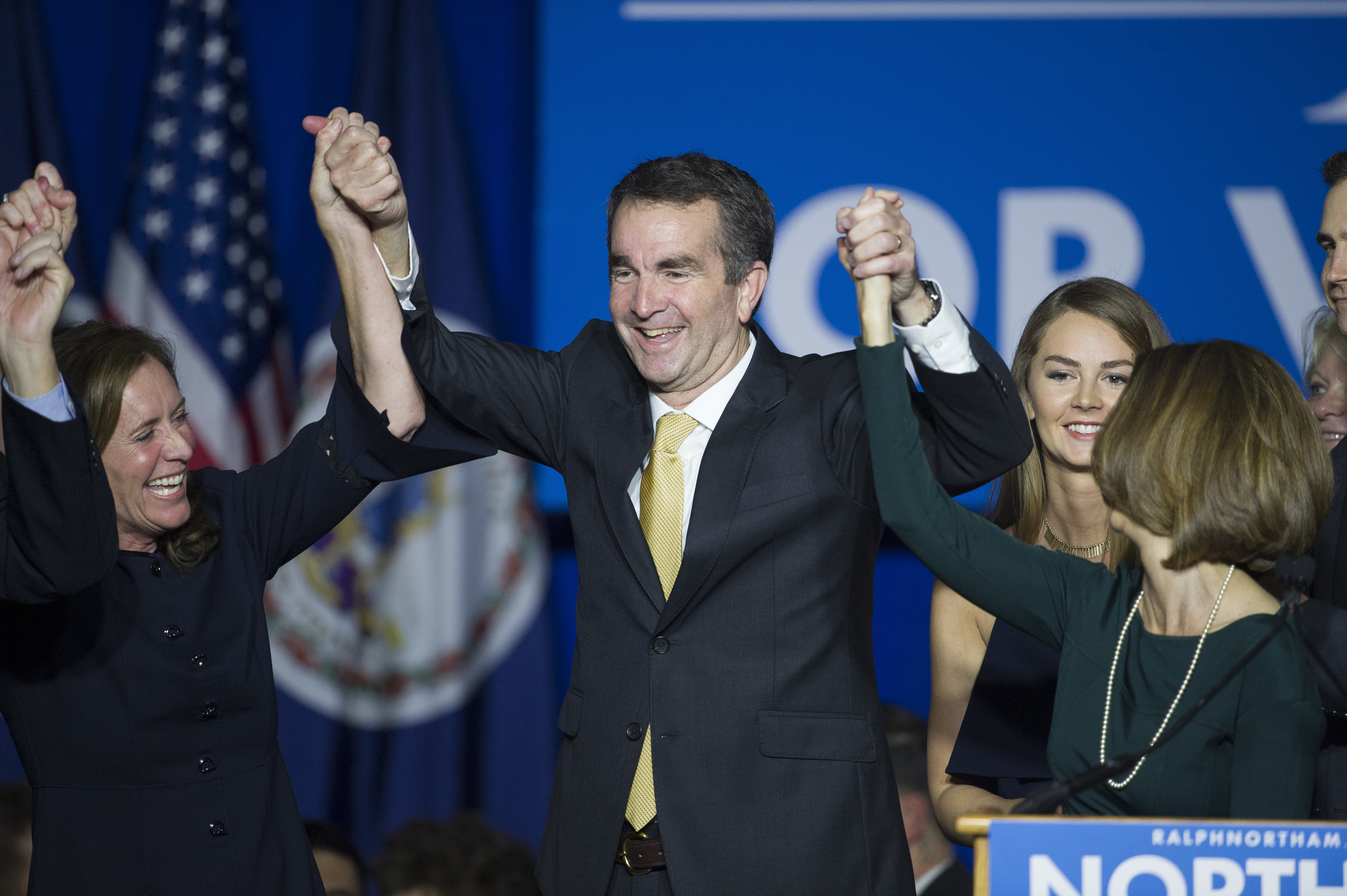 Virginia Gov.-elect Ralph Northam celebrates his election victory with his wife Pam and daughter Aubrey, right, and Dorothy McAuliffe (AP Photo/Cliff Owen)