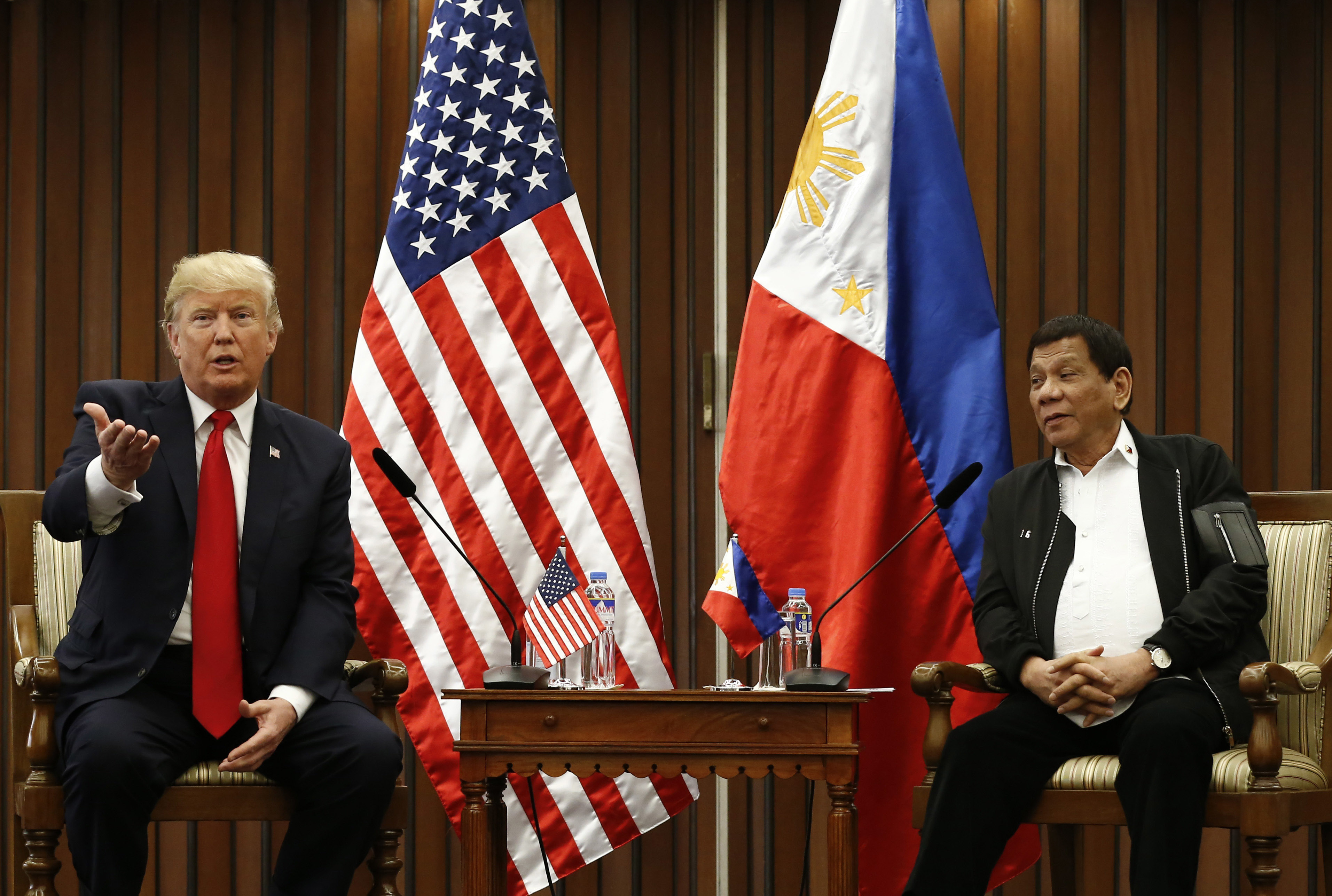 U.S. President Donald Trump, left, gestures beside Philippine President Rodrigo Duterte as they hold a bilateral meeting on the sidelines of the 31st Association of Southeast Asian Nations (ASEAN) Summit and Related Meetings at the Philippine International Convention Center in Manila, Philippines Monday Nov. 13, 2017. (CREDIT: Rolex dela Pena/Pool Photo via AP)