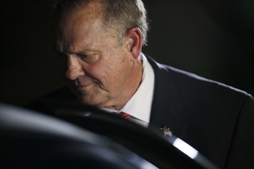 Former Alabama Chief Justice and U.S. Senate candidate Roy Moore leaves after he speaks at a church revival, Tuesday, Nov. 14, 2017, in Jackson, Ala. (AP Photo/Brynn Anderson)
