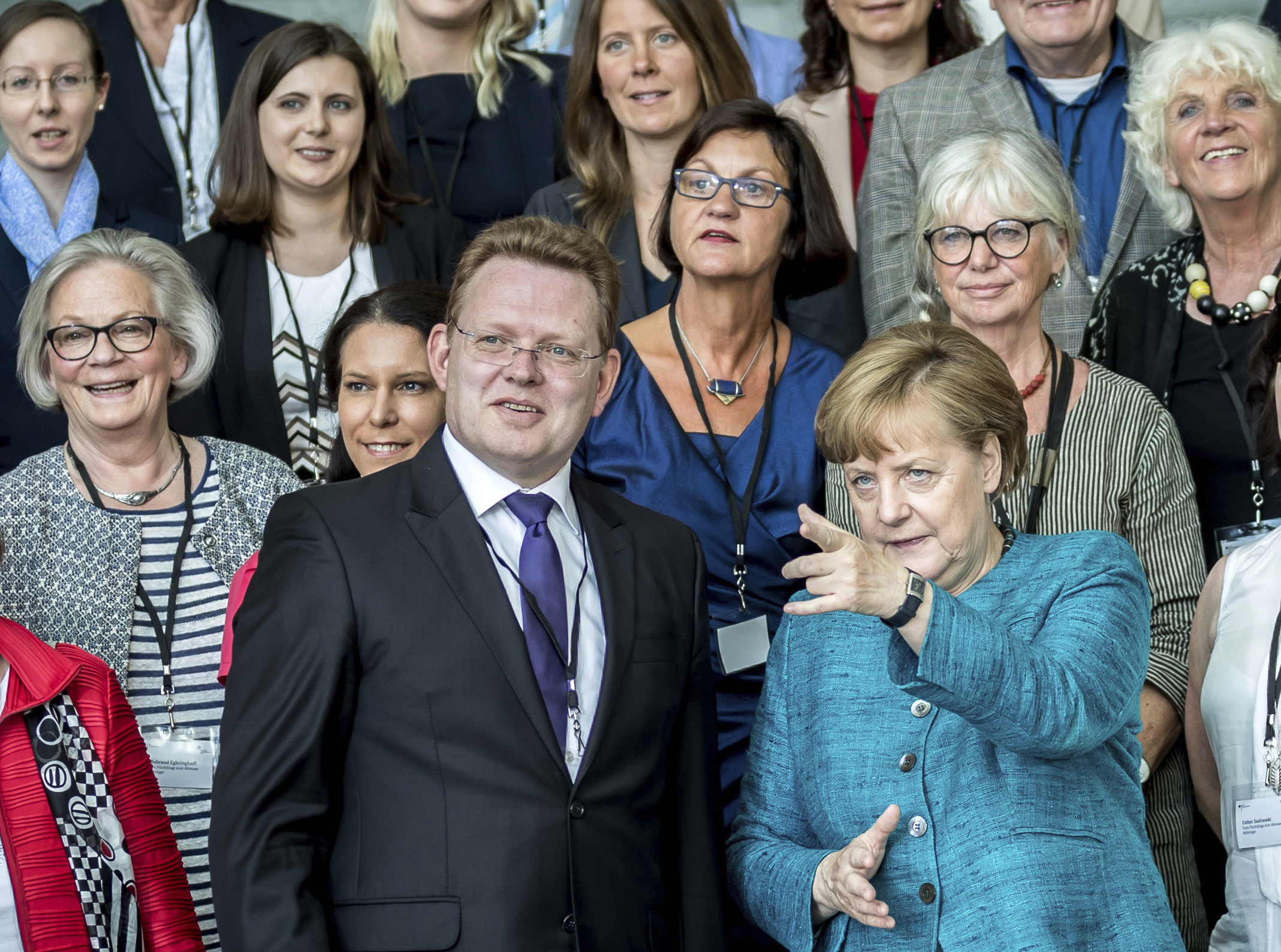 German Chancellor Angela Merkel talks to the mayor of the western German town of Altona, Andreas Hollstein during the award ceremony for the German national integration prize, May 17, 2017. Hollstein was injured in a knife attack on Monday evening. (CREDIT: Michael Kappeler/dpa via AP)