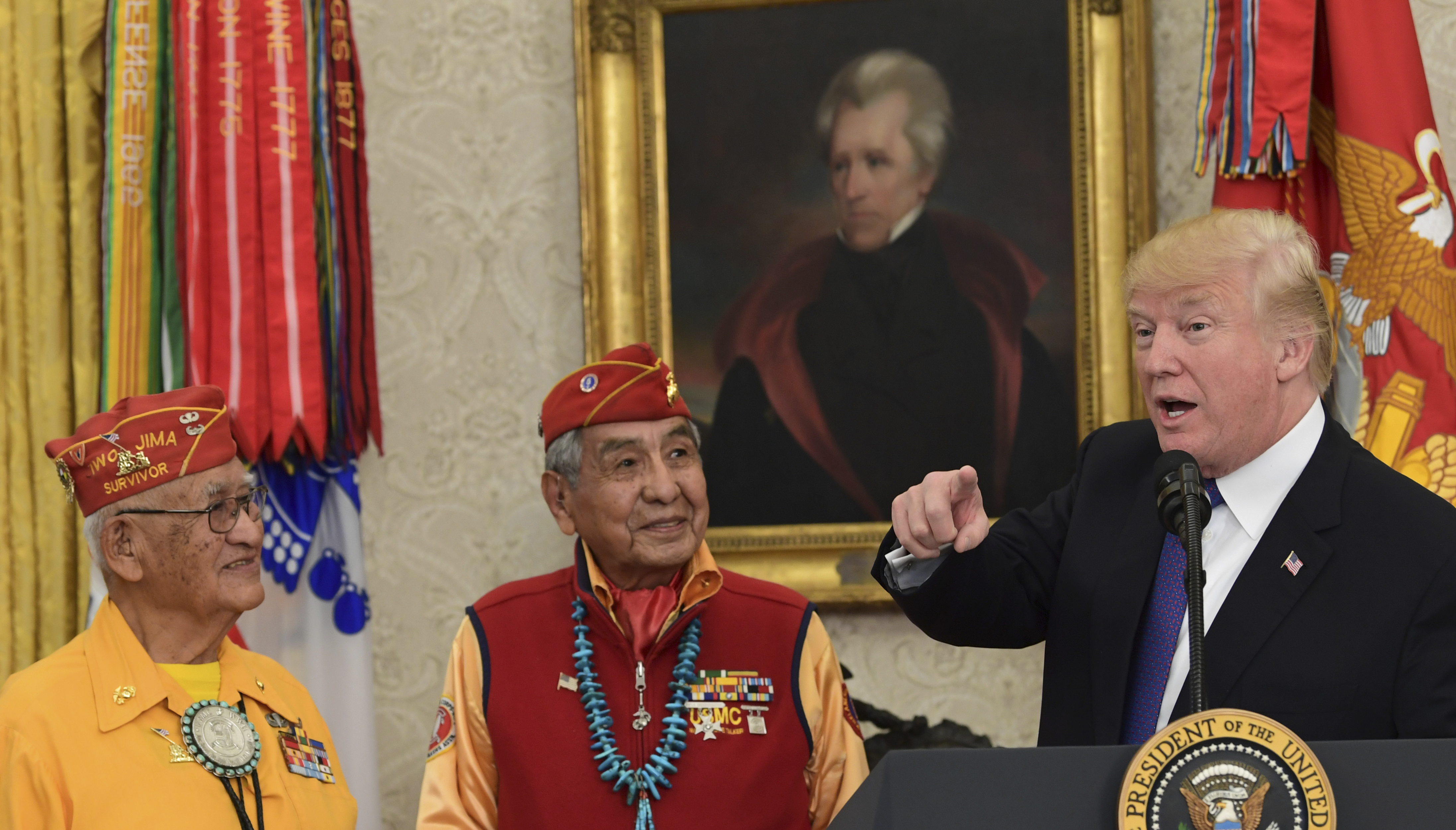 With a portrait of President Andrew Jackson hanging in the background, President Donald Trump, right, speaks during a meeting with Navajo Code Talkers on Monday. (CREDIT: AP Photo/Susan Walsh)