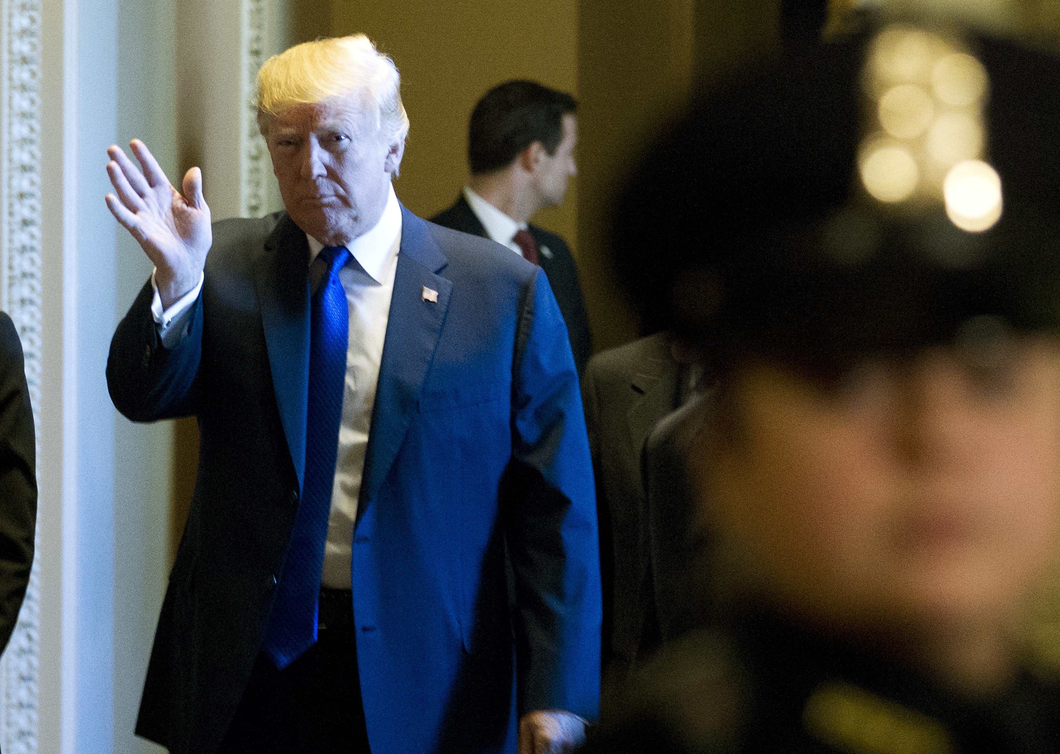 President Donald Trump waves to the media as he arrives at the Capitol to meet with GOP lawmakers in Washington, Tuesday, November 28, 2017. (CREDIT: AP Photo/Jose Luis Magana)