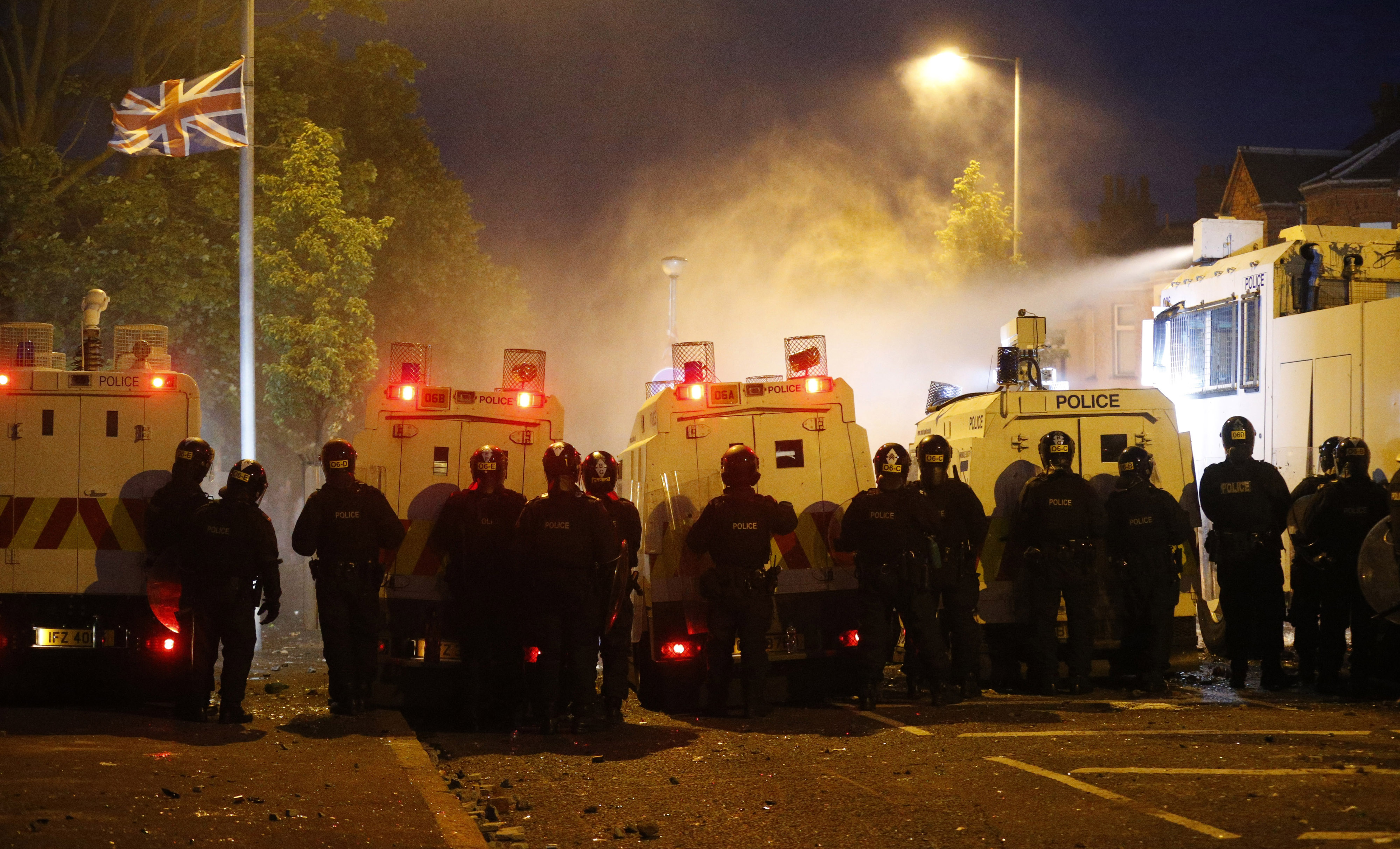 FILE PICTURE: Riot police deploy a water cannon after being attacked by loyalist protesters in north Belfast, Northern Ireland, Saturday, July 13, 2013. (CREDIT: AP Photo/Peter Morrison)
