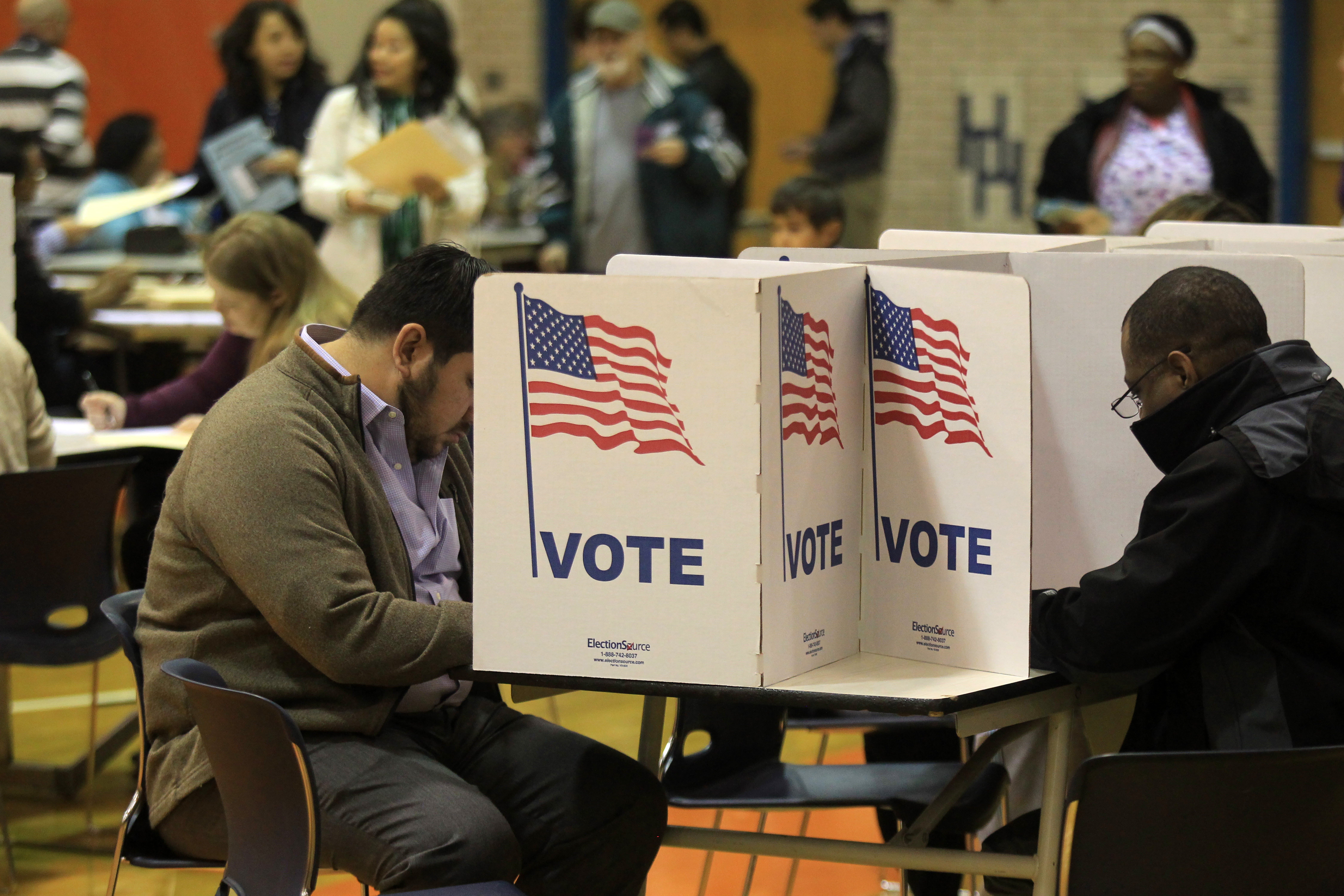 Voters cast their ballots in Alexandra, Virginia, 2016. CREDIT: mpi34/MediaPunch/IPX