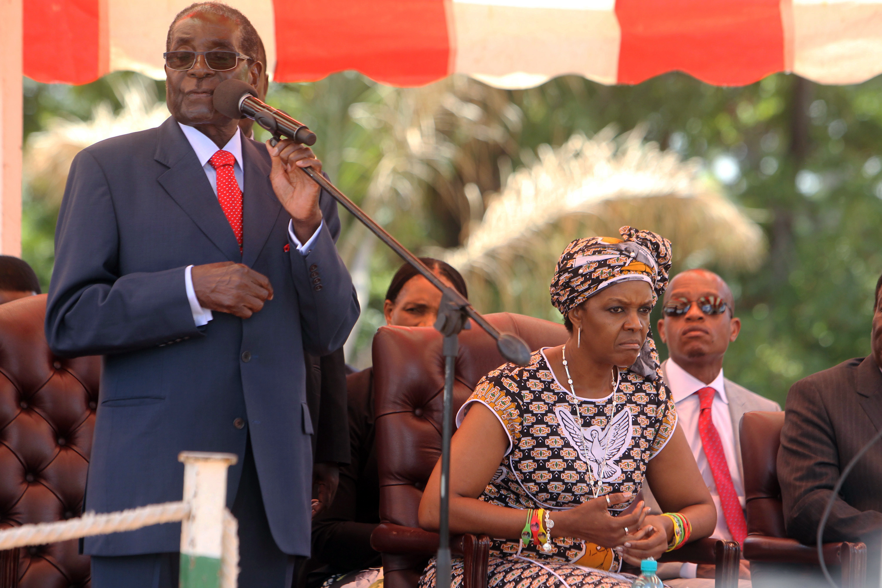 Zimbabwean President Robert Mugabe addresses supporters at the party headquarters in Harare, while his wife Grace looks on. Mugabe, the world's oldest head of state, recently warned officials of his ZANU-PF party to stop insulting each other. A lot of the bitter quarrels, which come ahead of Mugabe's 92nd birthday on Feb. 21, happen on Twitter and other social media platforms, provided Zimbabweans with a stream of nasty, colorful and sometimes entertaining quips. CREDIT: Tsvangirayi Mukwazhi/AP Photo.