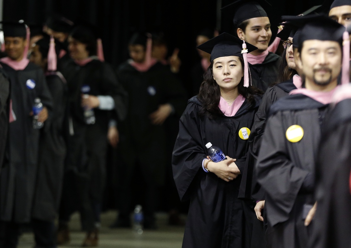 Berklee College of Music graduates line up before commencement ceremonies Saturday, May 9, 2015, in Boston. CREDIT: AP/Michael Dwyer