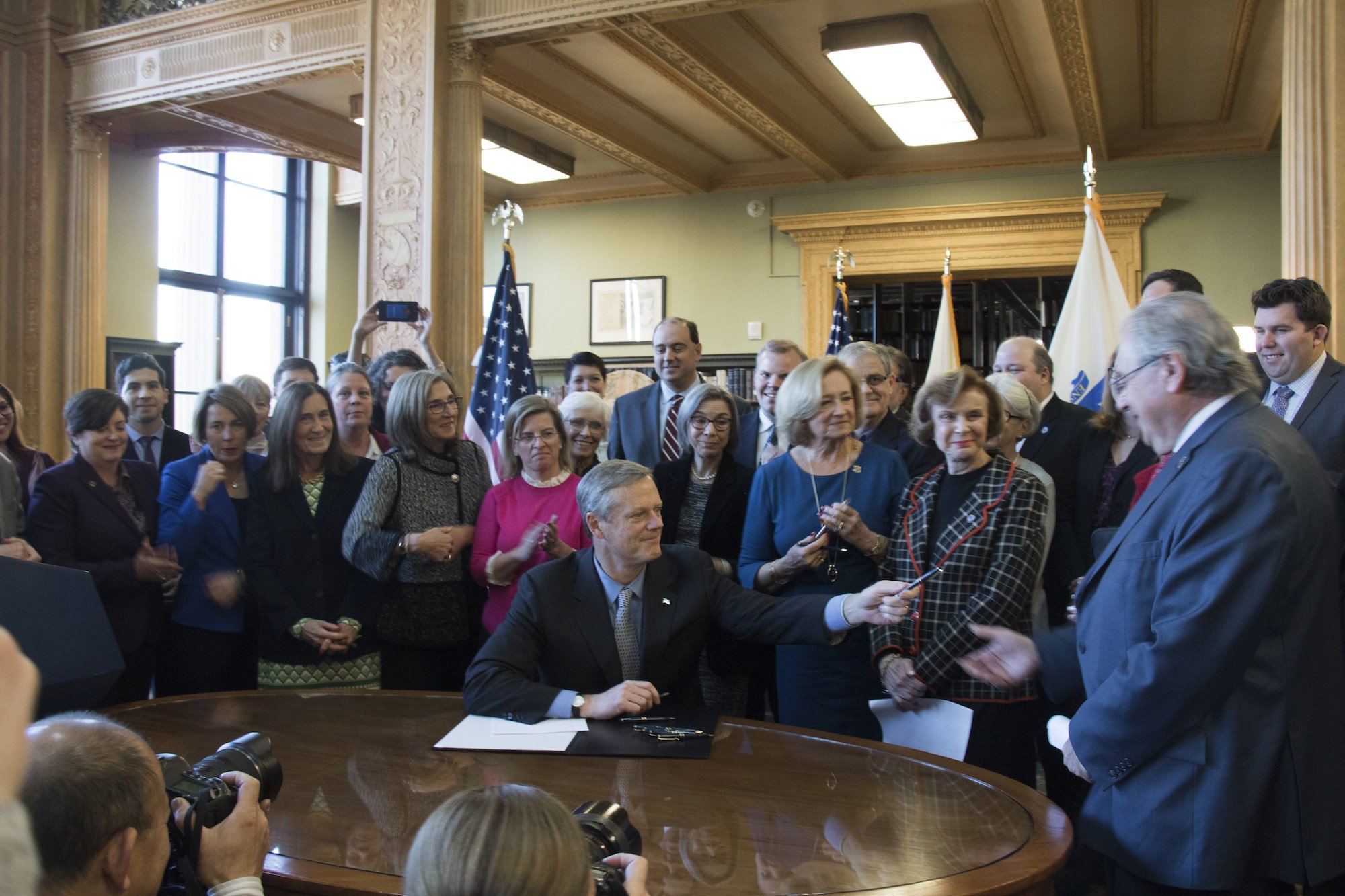 Massachusetts Gov. Charlie Baker signs bill that requires insurance companies to cover birth control coverage at no cost. (CREDIT: Twitter/@MassGovernor)