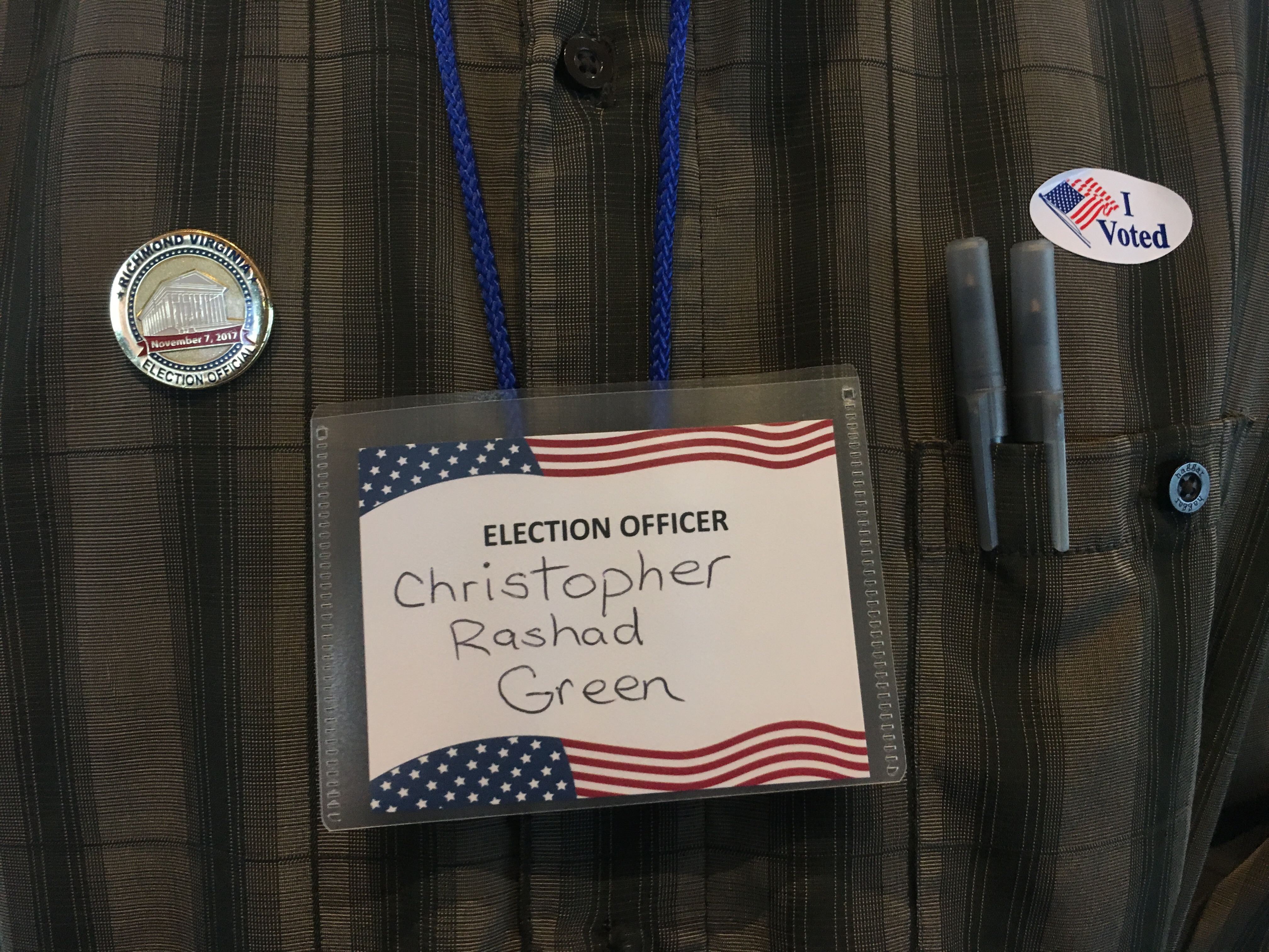 Green's name badge and "I voted" sticker. CREDIT: Kira Lerner