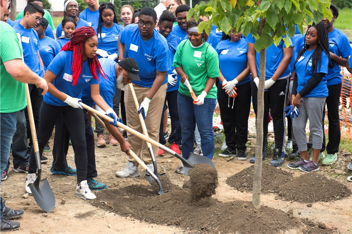 Residents, students, and caregivers at the Cleveland Clinic plant trees in Fairfax, Ohio. Credit: Cleveland Clinic