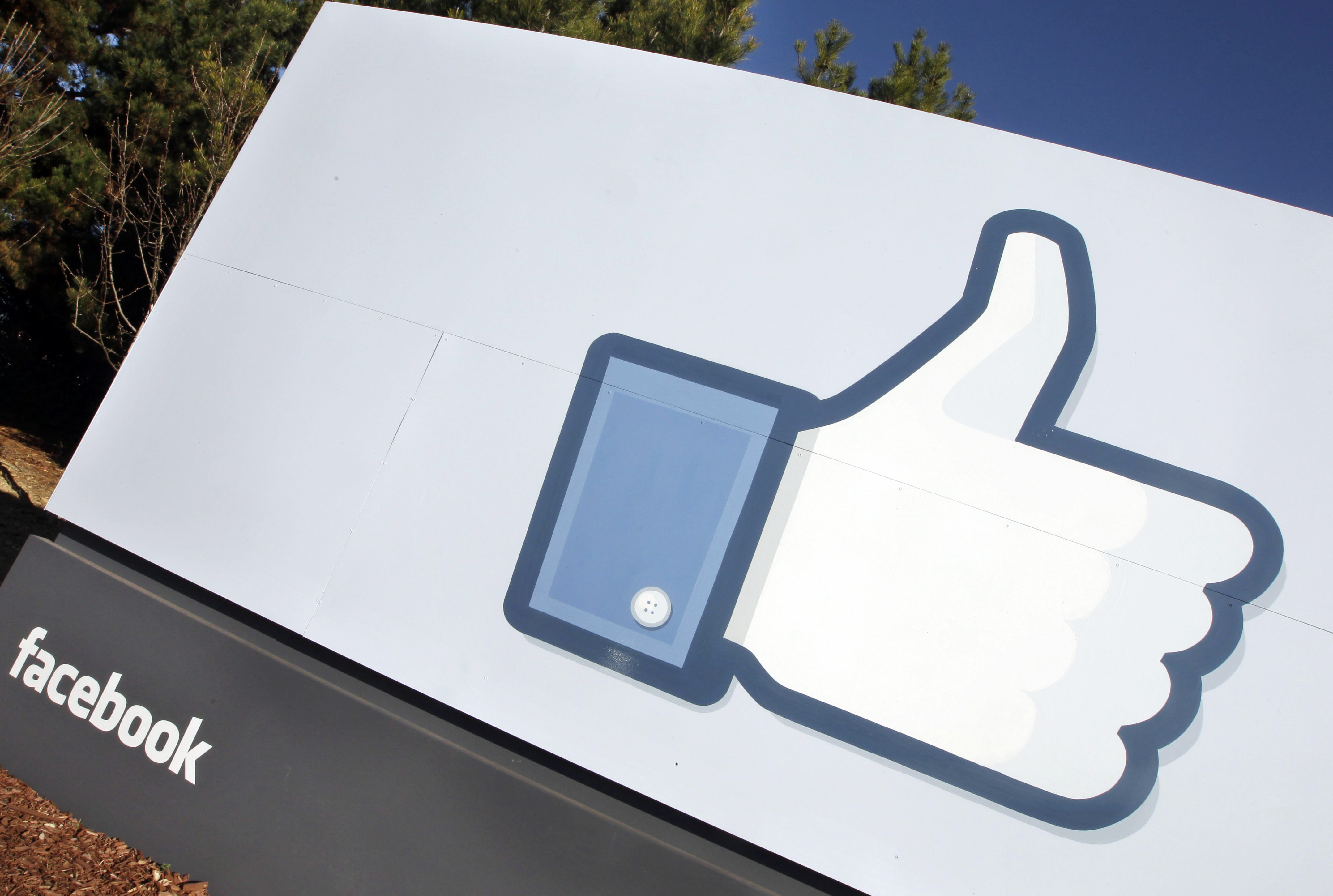 FILE - A Jan. 12, 2012 file photo, shows the Facebook "like" icon displayed outside of Facebook's headquarters in Menlo Park, Calif. (AP Photo/Paul Sakuma)